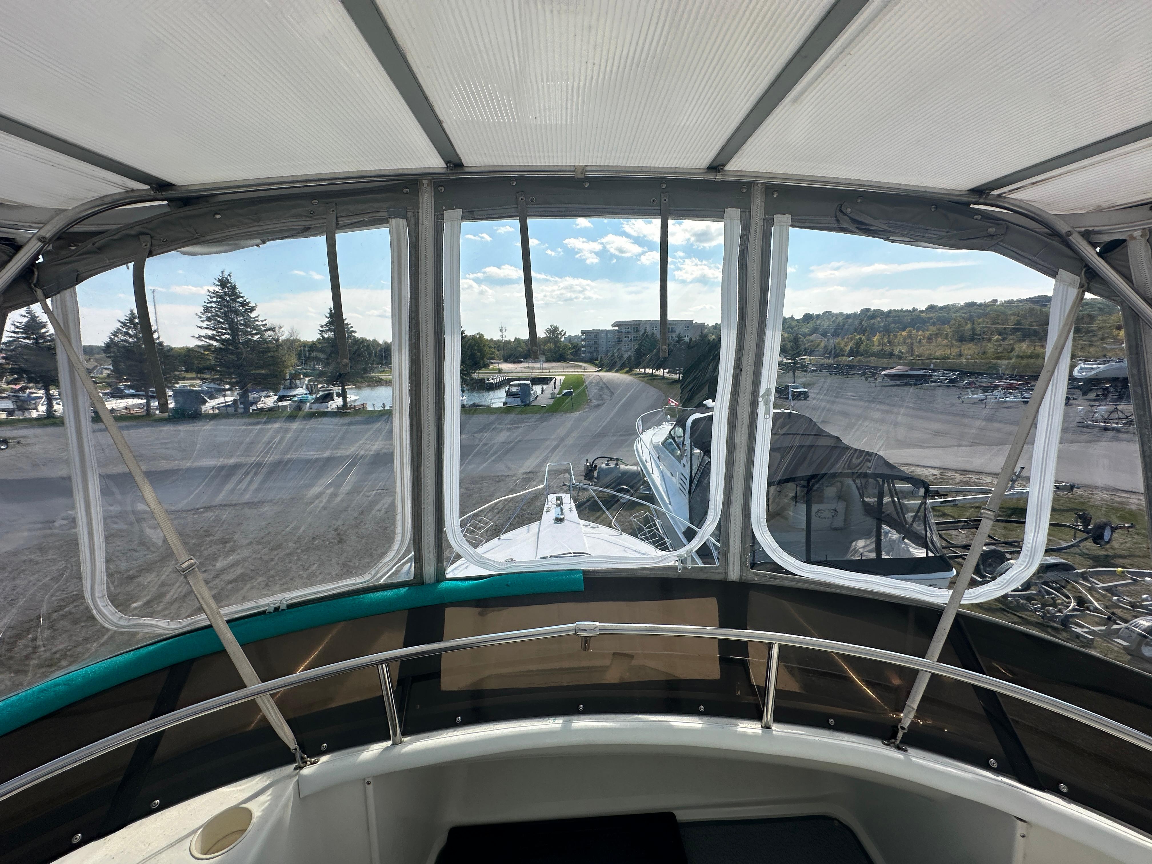 1994 Silverton 34 Aft Cabin Motor Yacht interior view with marina background.