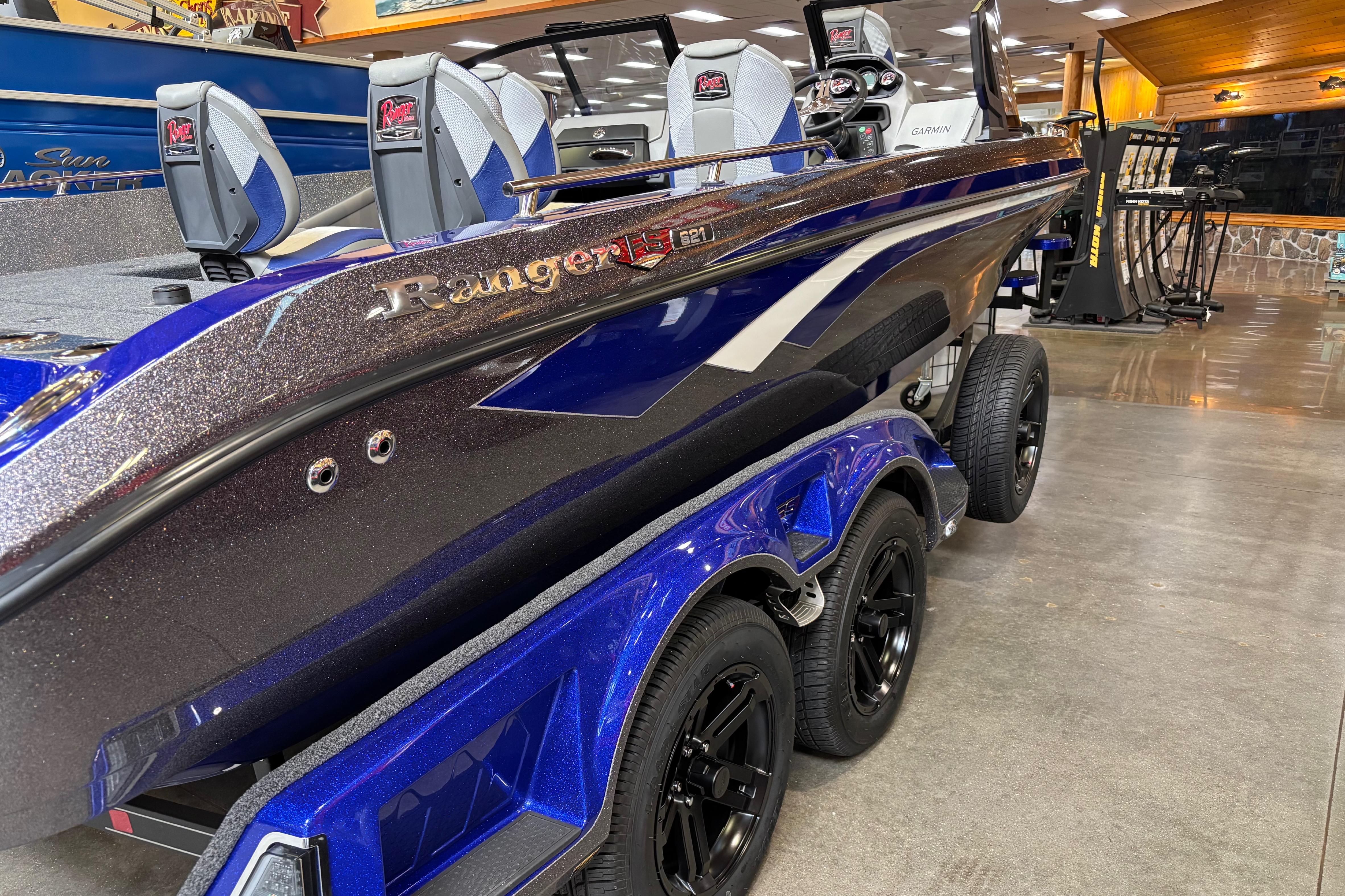 2026 Ranger 621FS Cup-Equipped boat in showroom, featuring sleek design and vibrant blue color.