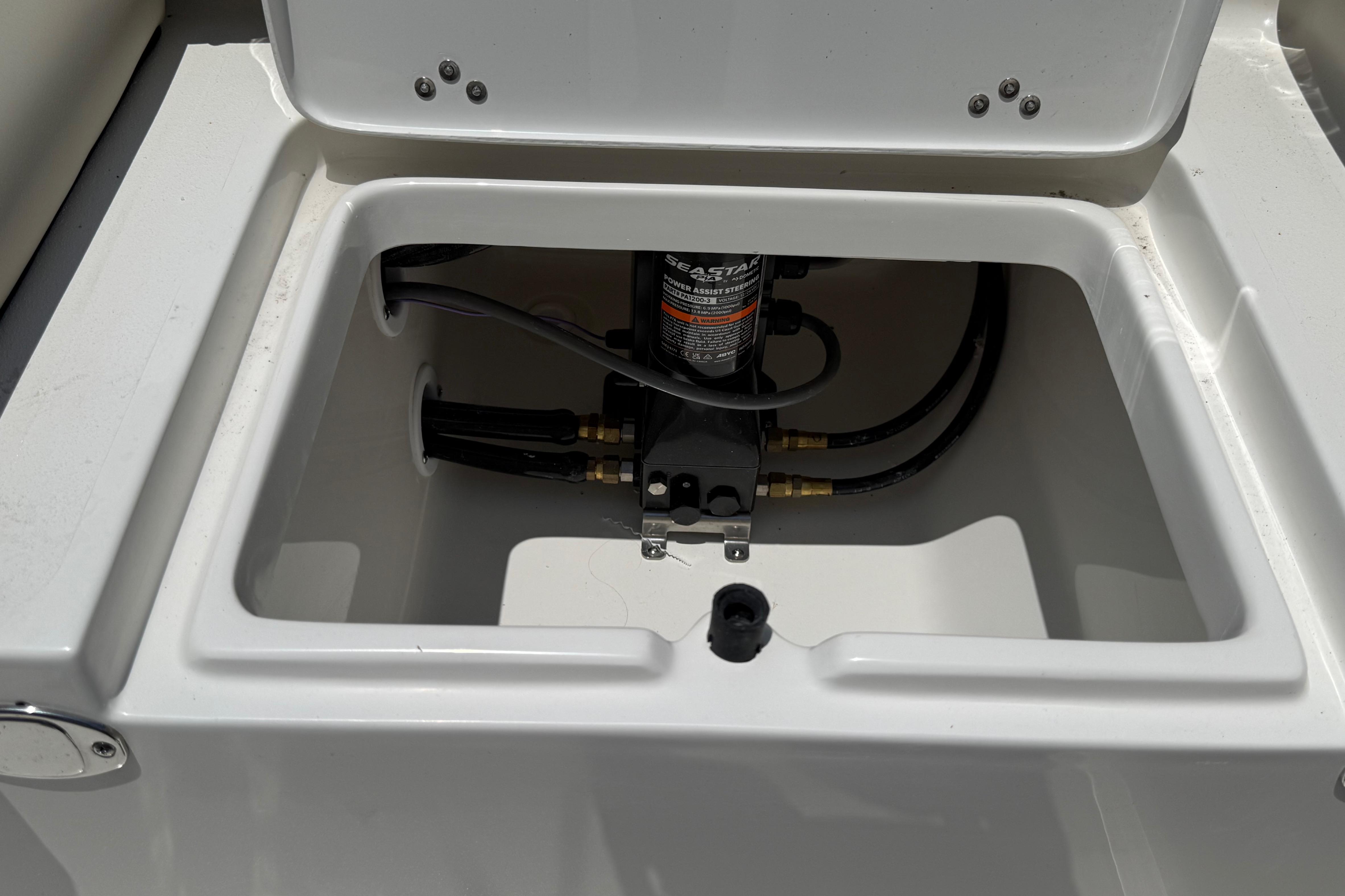 2027 Key West 249 FS boat compartment with hydraulic system components.