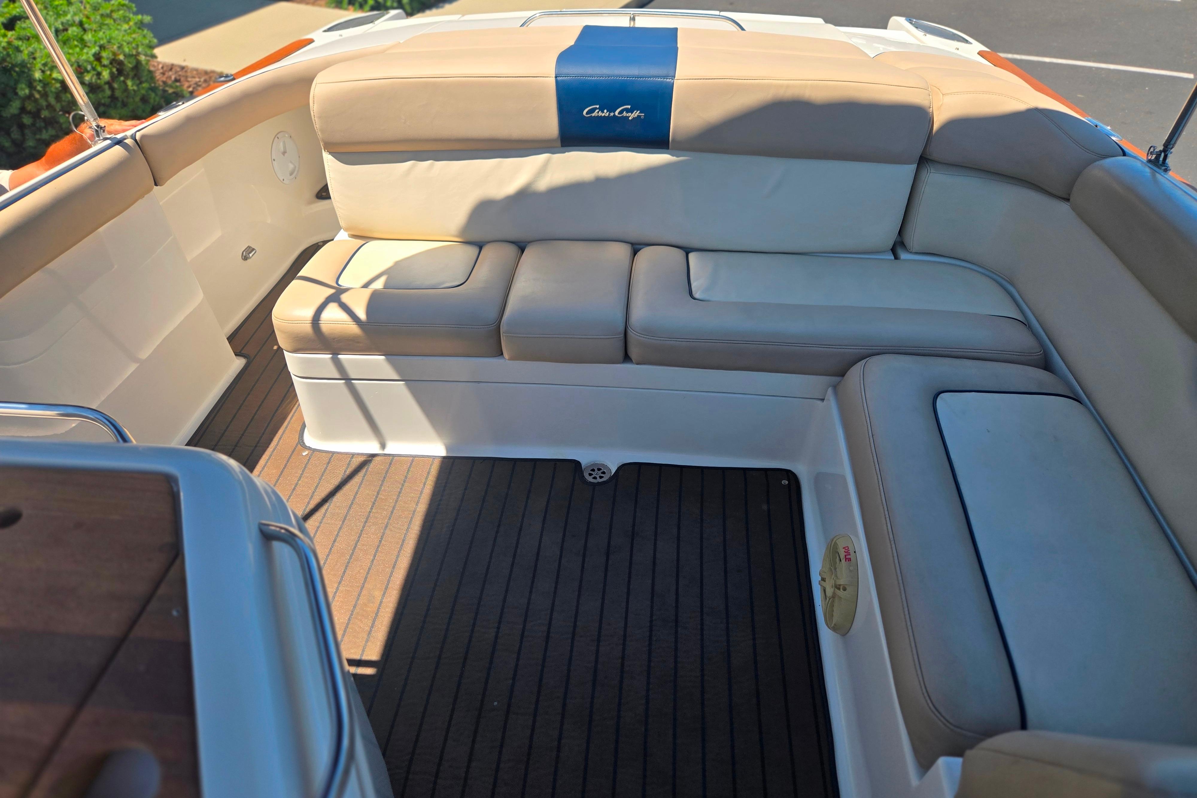 Luxurious seating on 2002 Chris-Craft Launch 28 GT I/O boat with elegant upholstery.