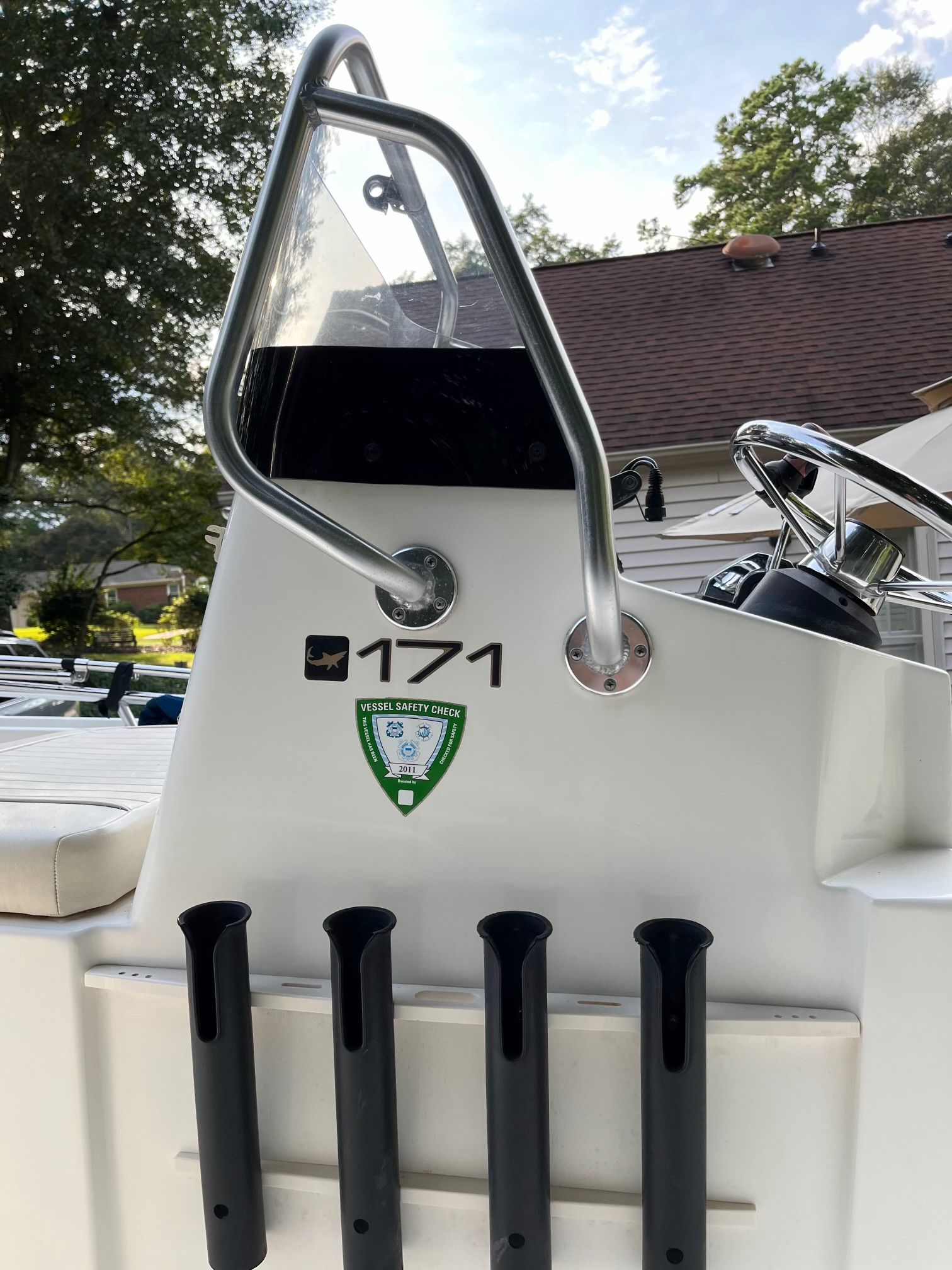 2006 Mako 171 Center Console boat with safety check sticker.
