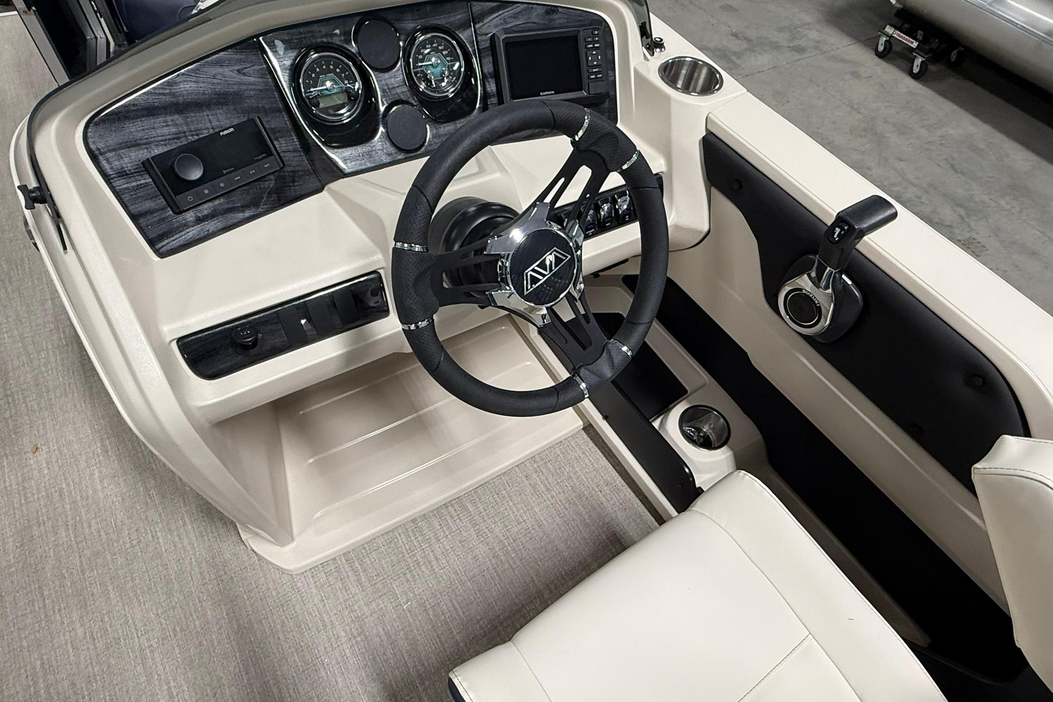 2026 Avalon LSZ Elite 21' boat interior with modern dashboard and steering wheel.