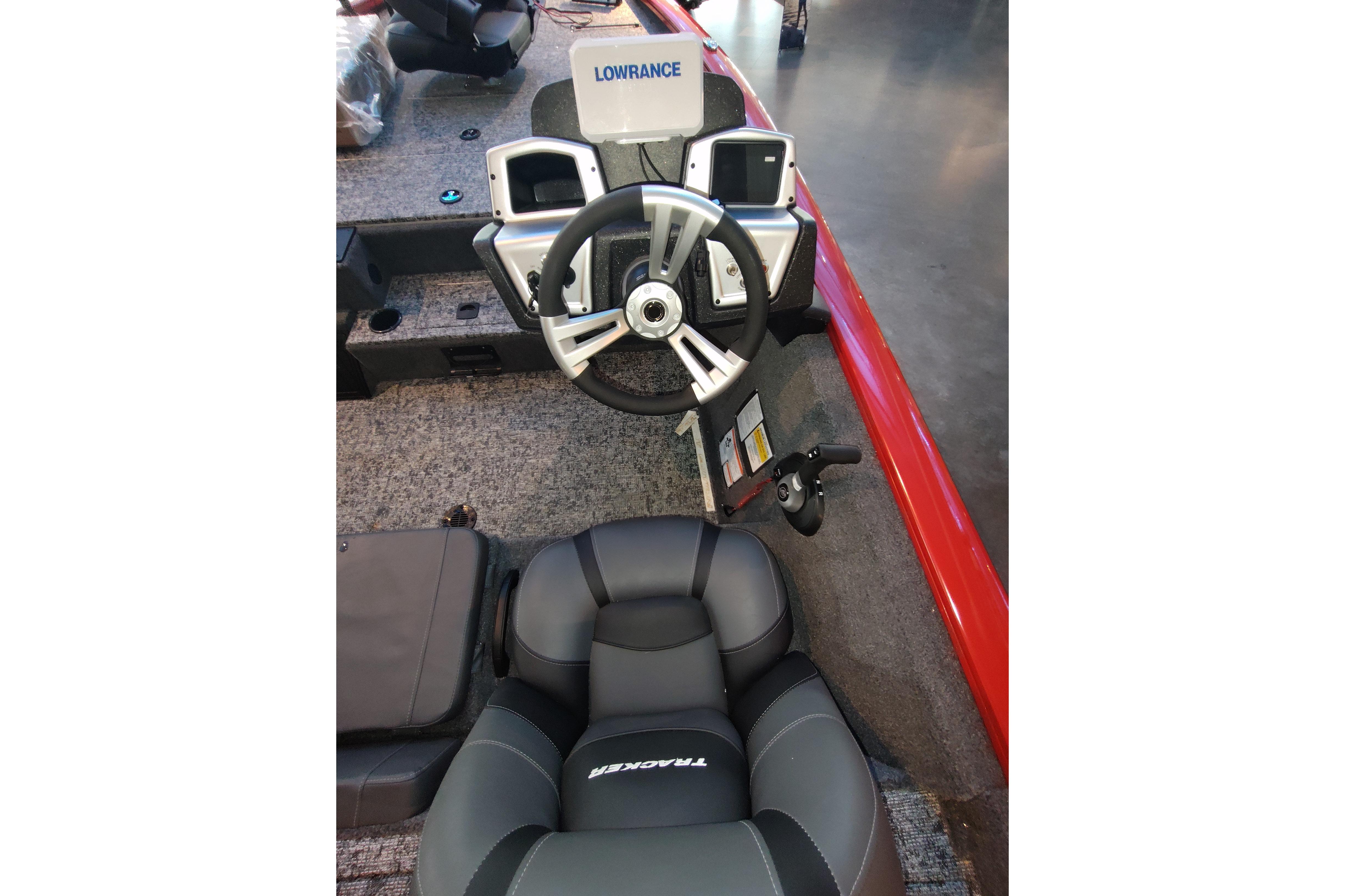 2026 Tracker Pro Team 195 boat interior with steering wheel and Lowrance electronics.