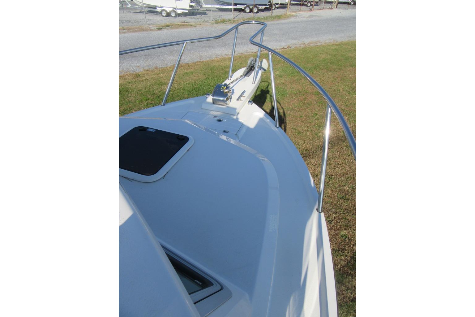 2024 Parker 2320 SL Sport Cabin boat deck with railing and hatch.