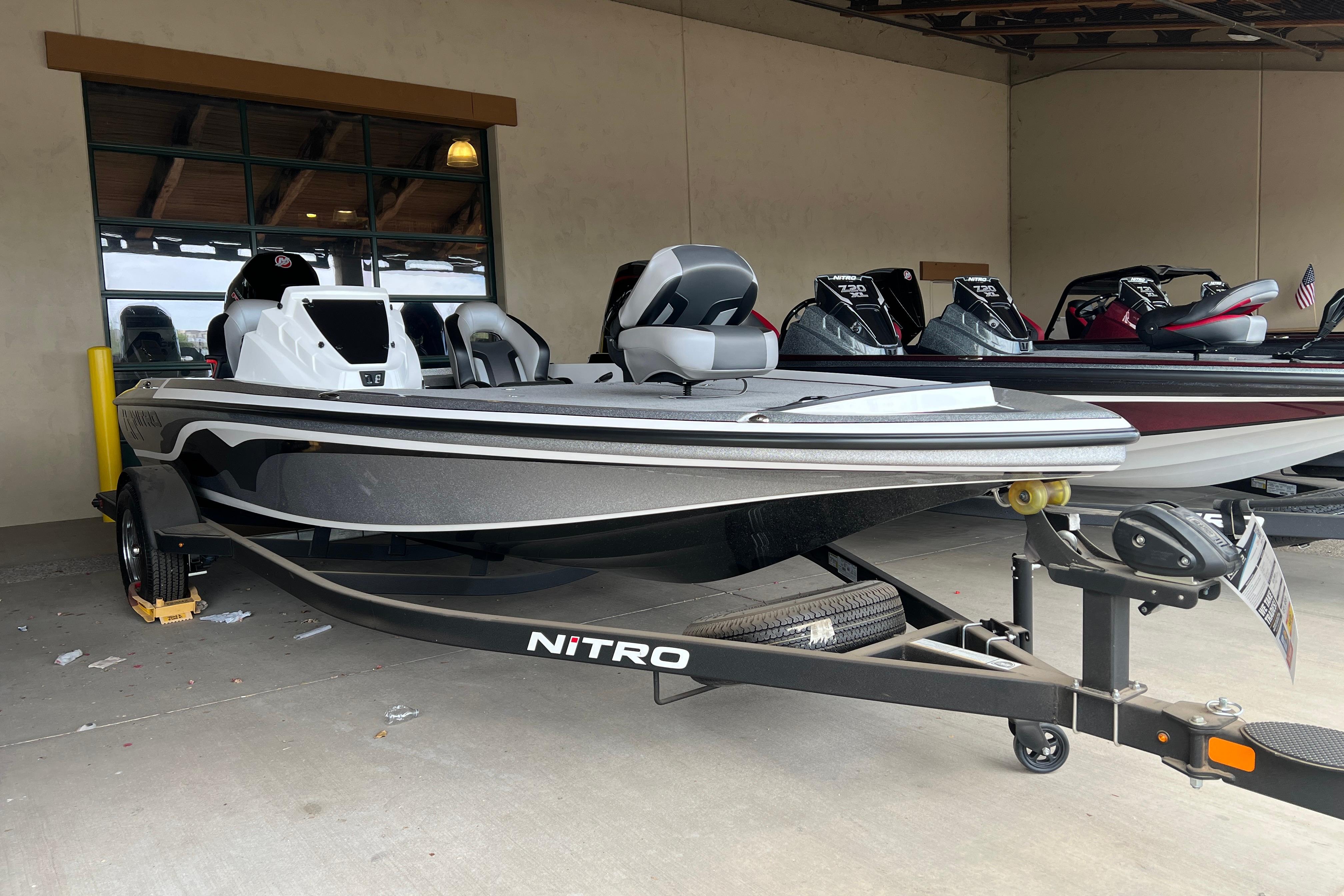 2026 Nitro Z19 XL Pro boat on trailer in showroom setting.