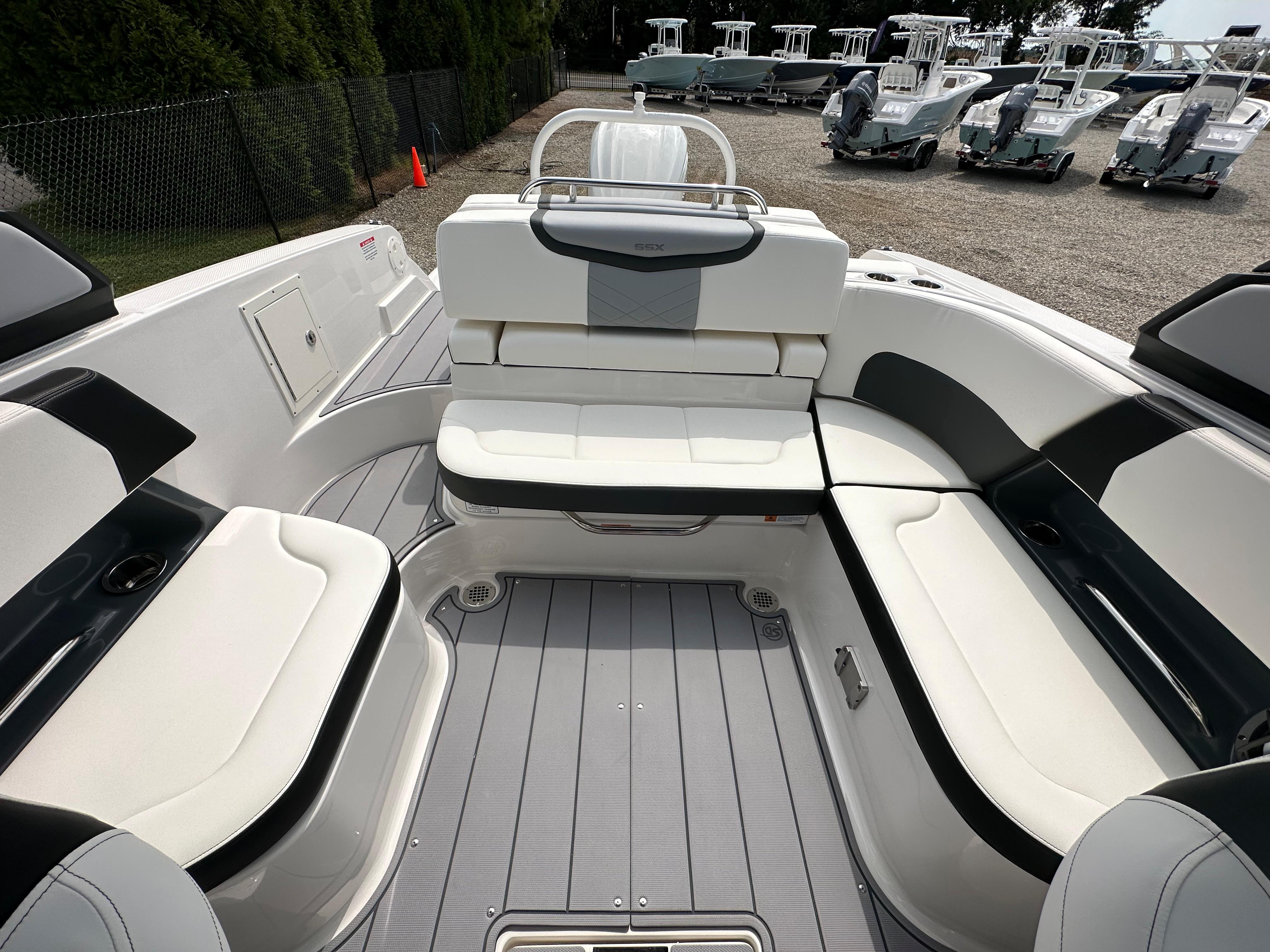 2023 Chaparral 270 OSX boat interior with white seating and sleek design.