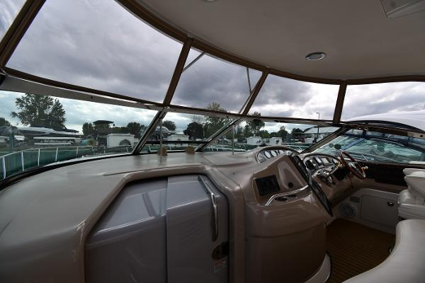 Interior view of 2003 Sea Ray 460 Sundancer yacht cockpit with panoramic windows.