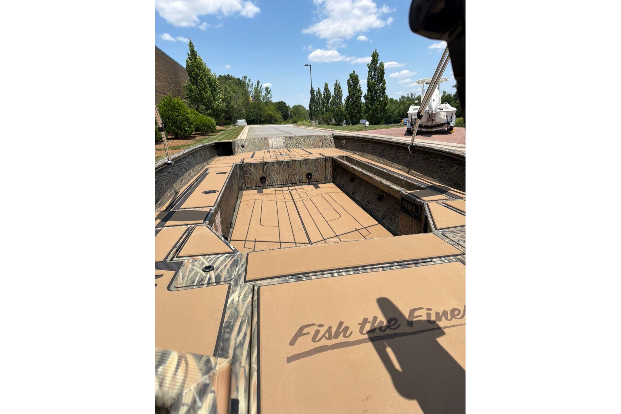 2026 Tracker Grizzly 1756 T Marsh boat with camo design and spacious interior.