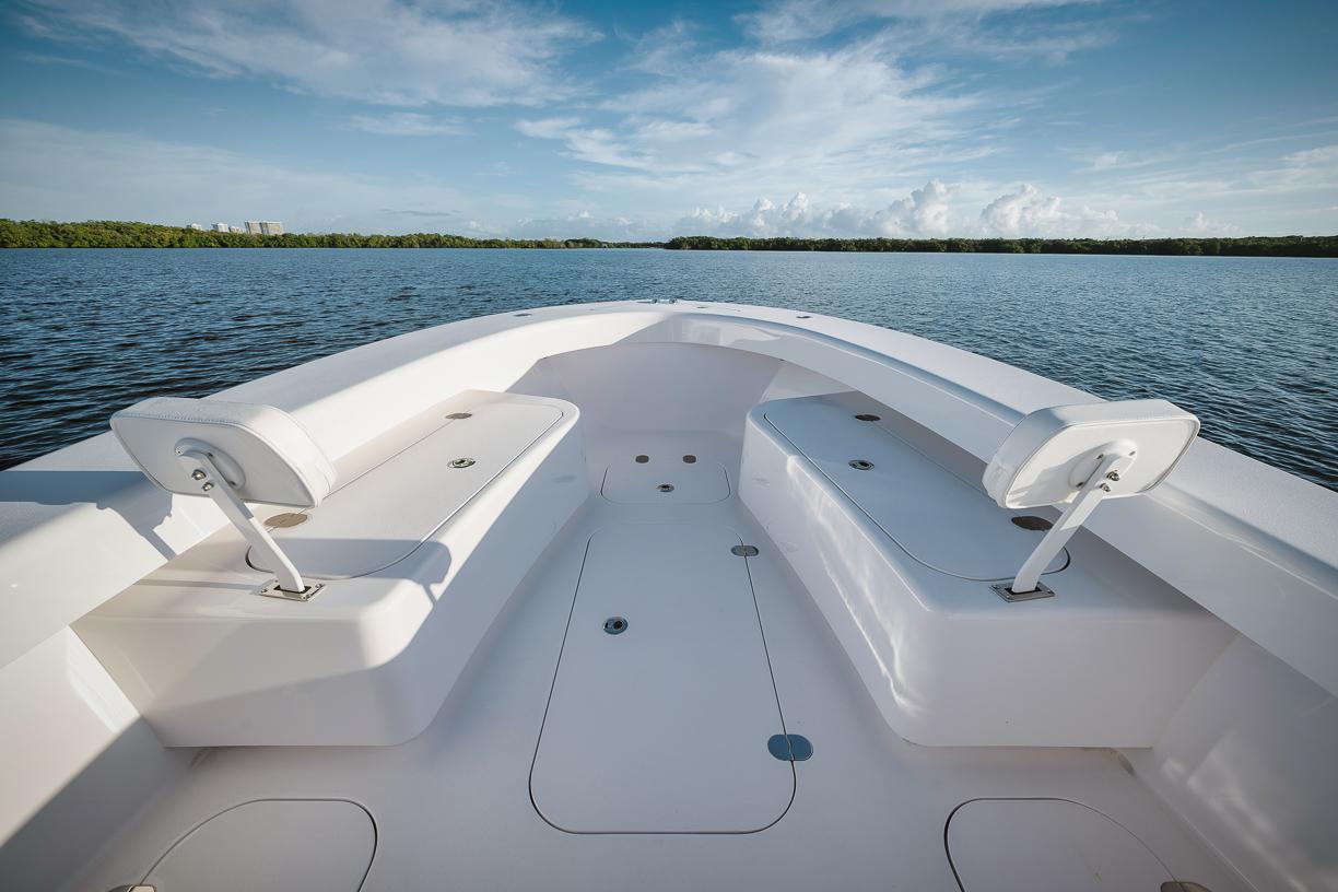 2024 Birdsall 30 boat interior with seating, on calm water.