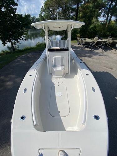 2024 Ranger 2600 Bay boat, sleek design, spacious deck, parked near a serene lake.