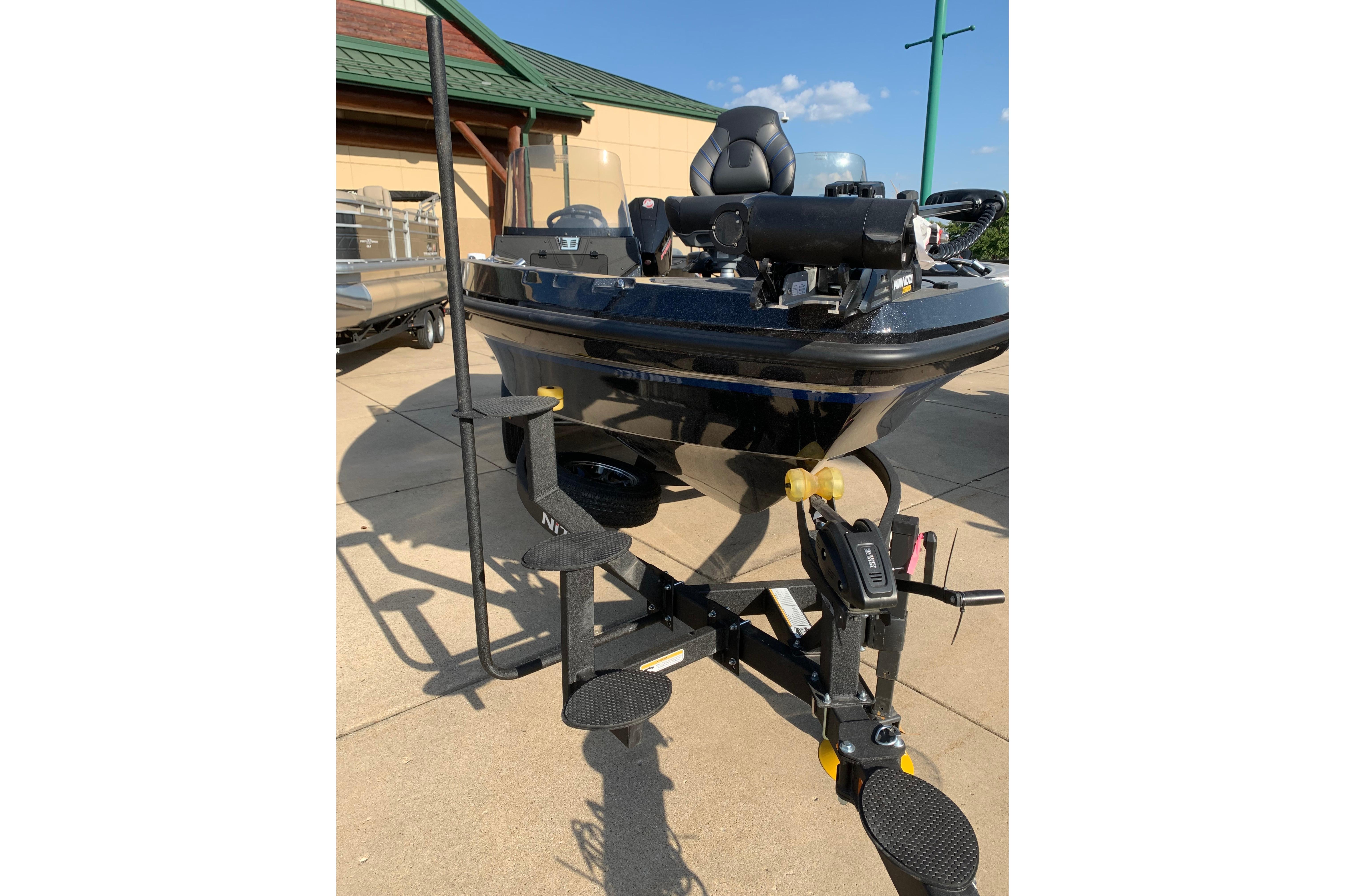 2025 Nitro ZV20 boat on trailer, outdoor display, sunny day.