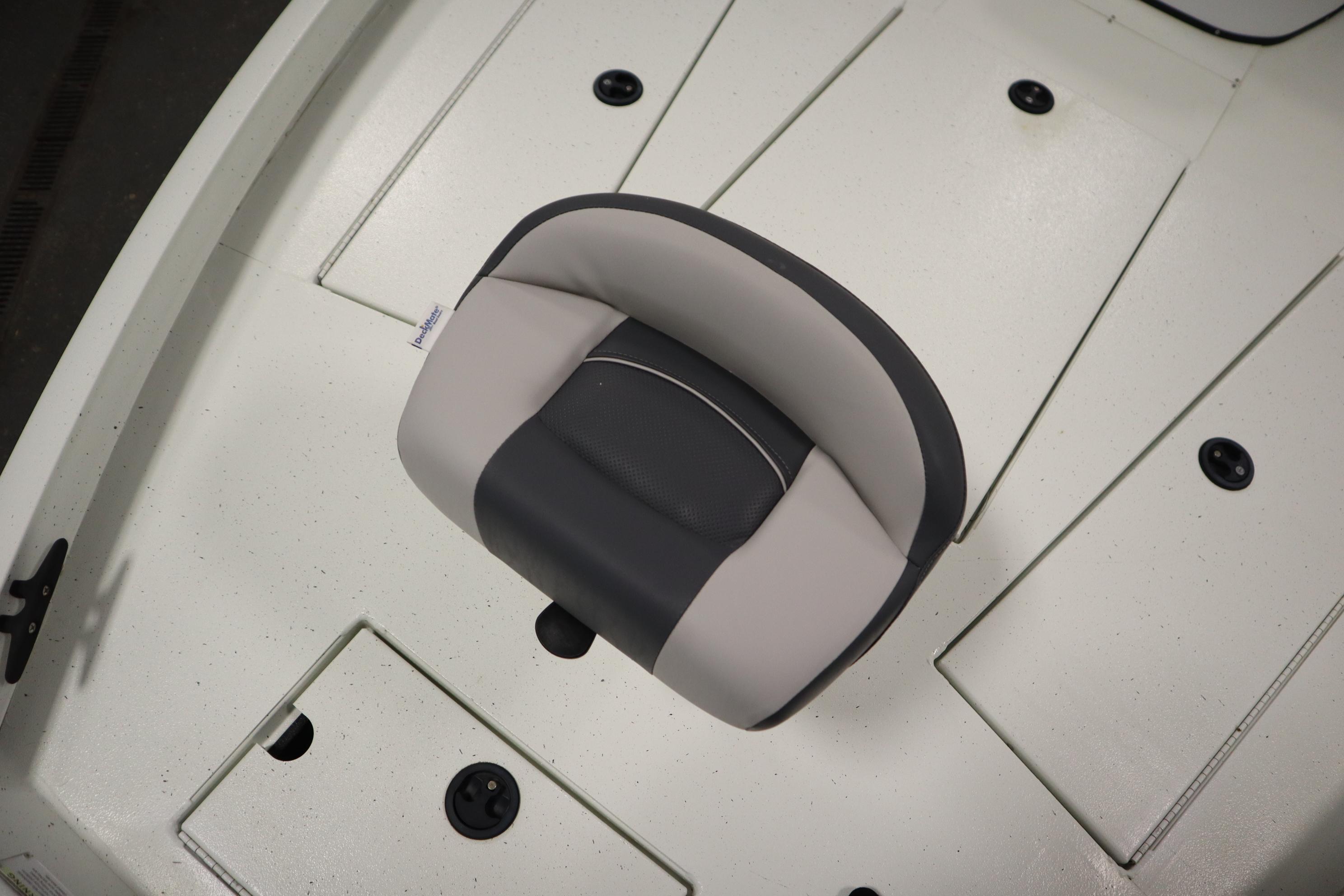 Crestliner 2200 CC 2022 boat seat on white deck, top view.