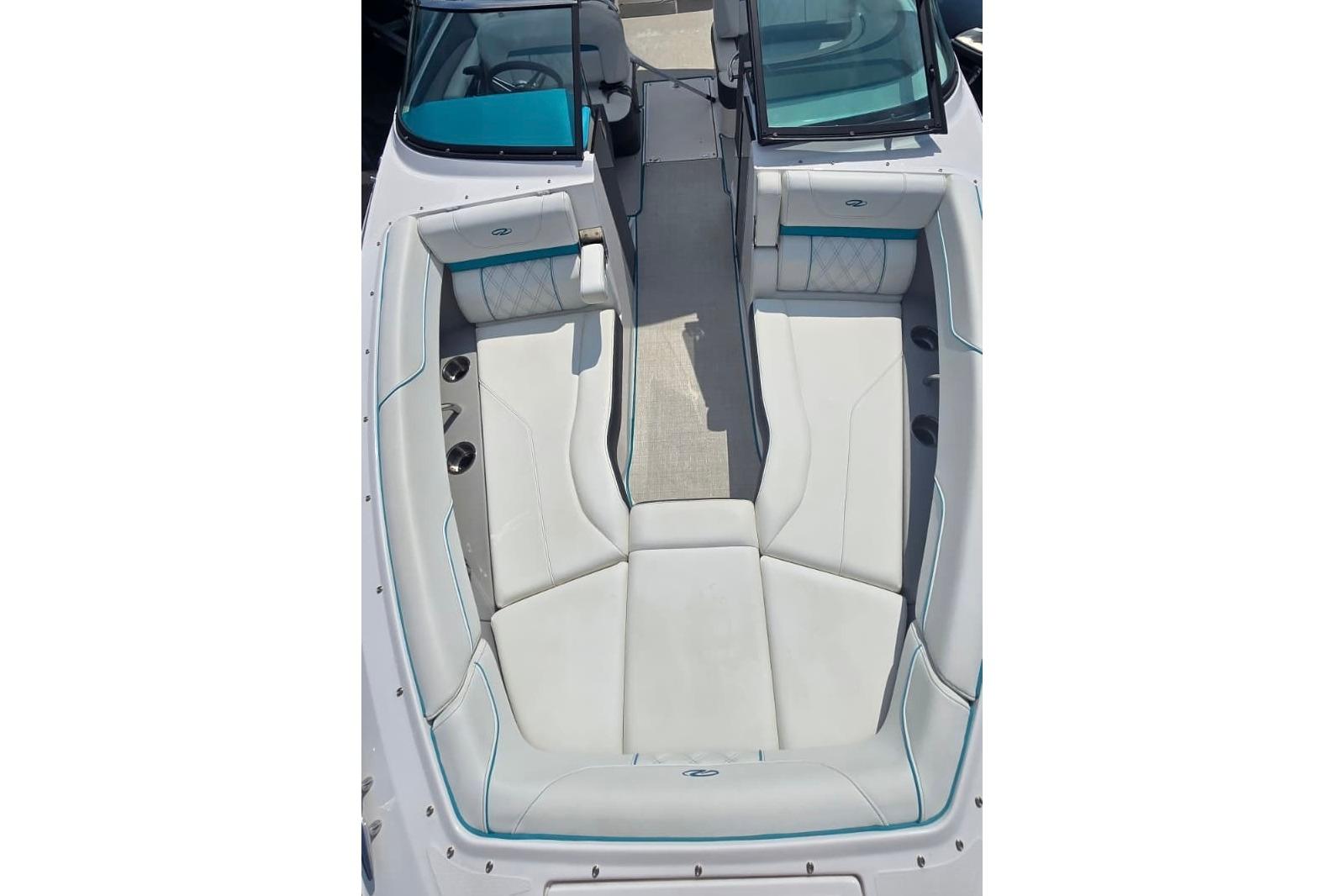 2020 Regal LS6 boat interior with white seating and teal accents.