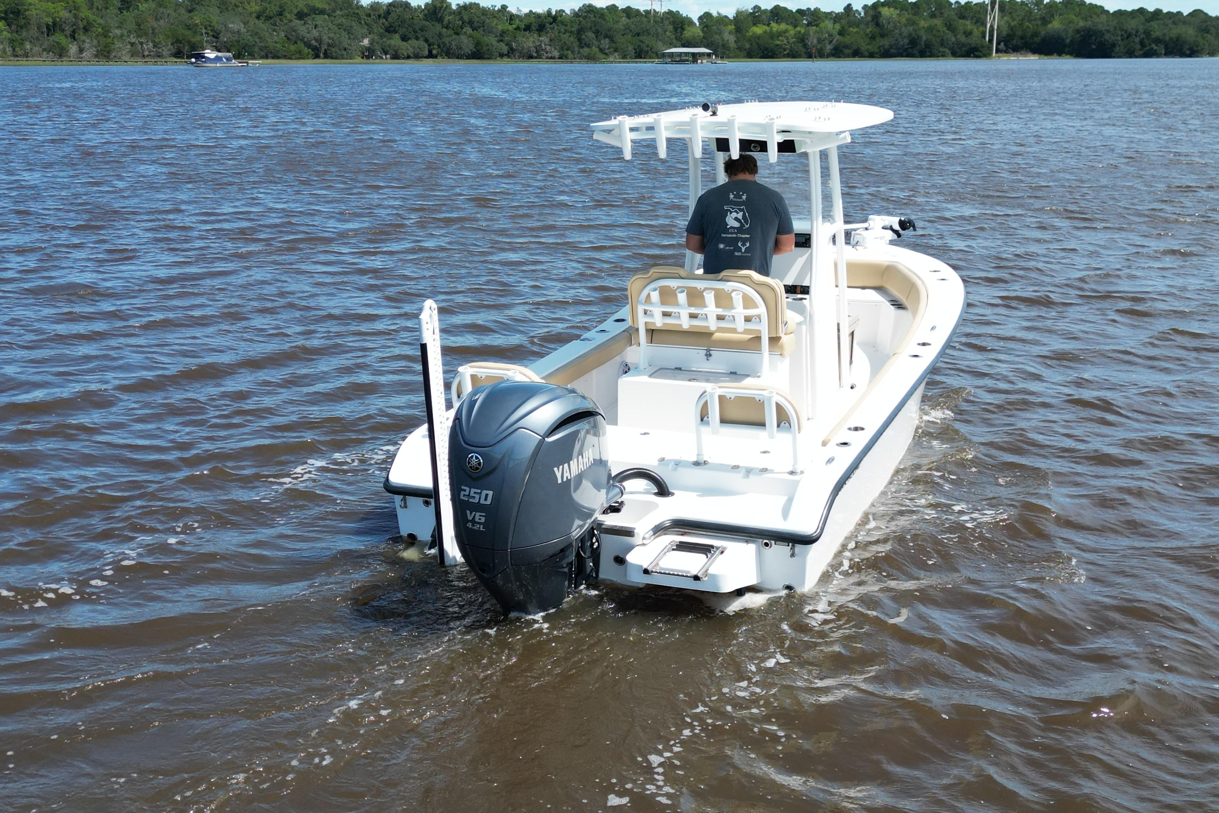2024 Clark Sound 24 boat with Yamaha 250 V6 engine on a lake.