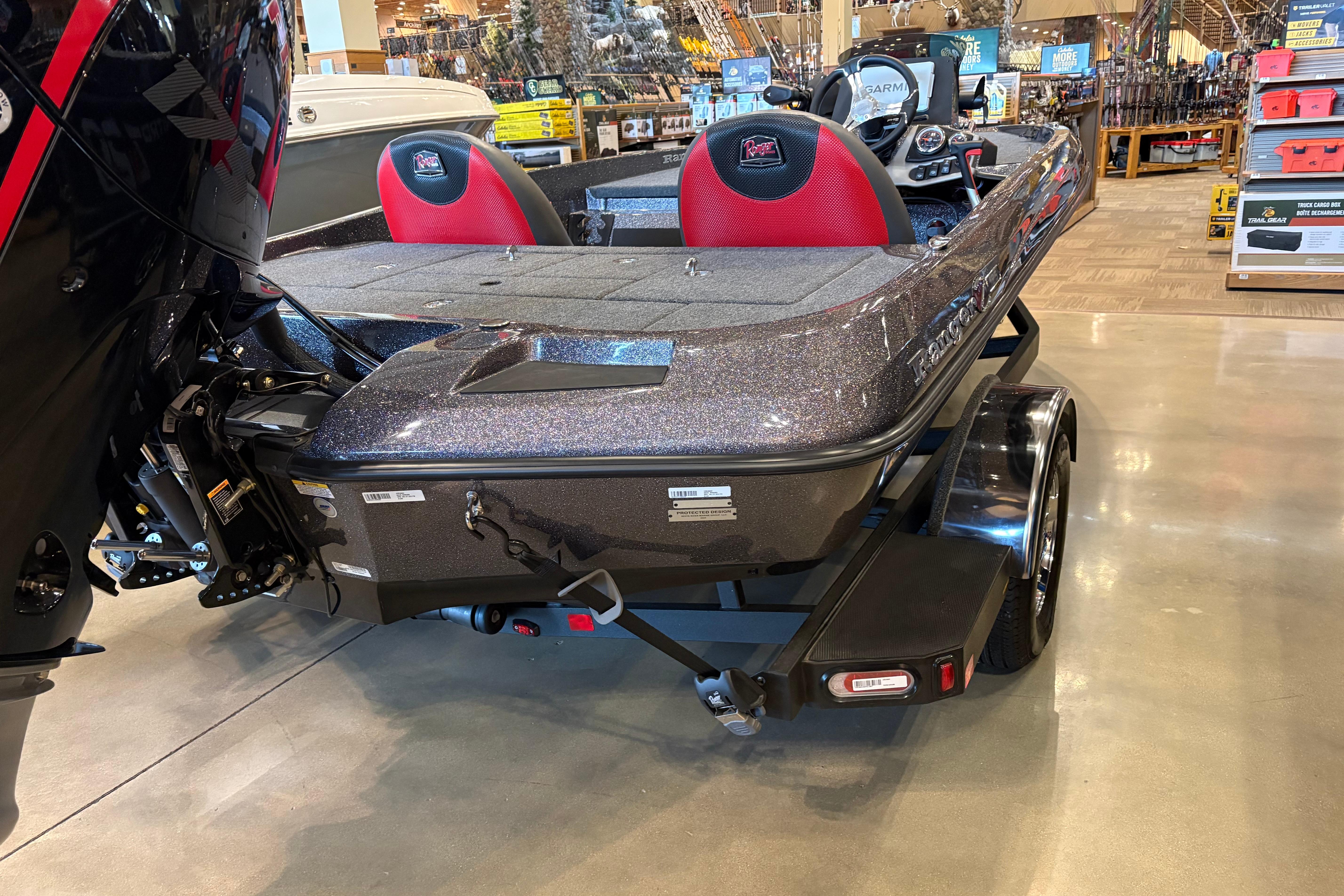 2025 Ranger Z185 boat displayed indoors, featuring red seats and a sleek design.