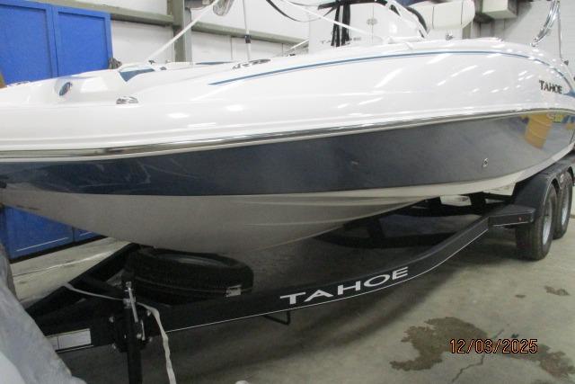 2024 Tahoe 2150 CC boat on trailer in indoor storage facility.