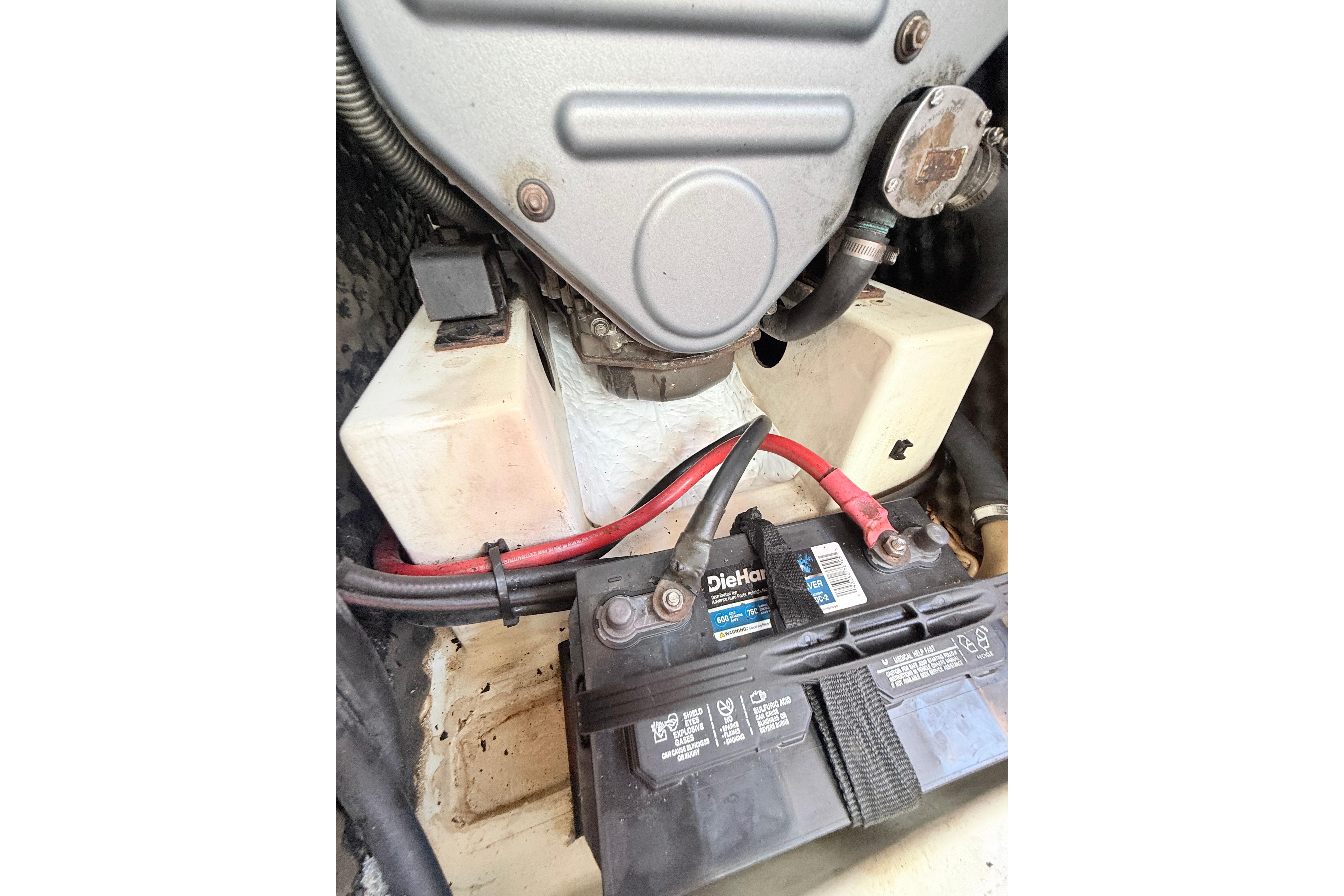 Engine compartment of a 2009 Beneteau Oceanis 40 sailboat with battery and wiring.