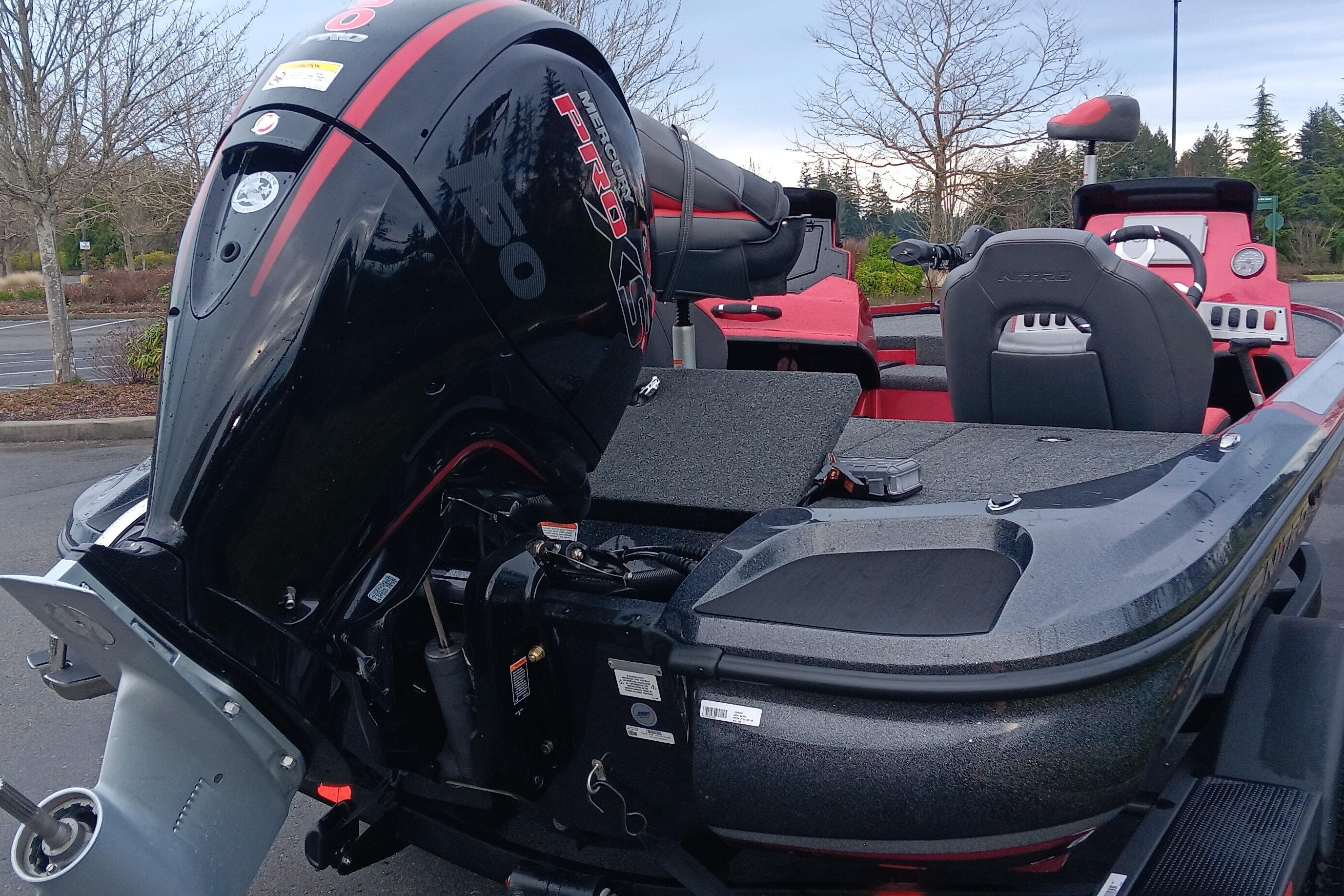 2026 Nitro Z18 Pro boat with powerful Mercury engine, parked outdoors.