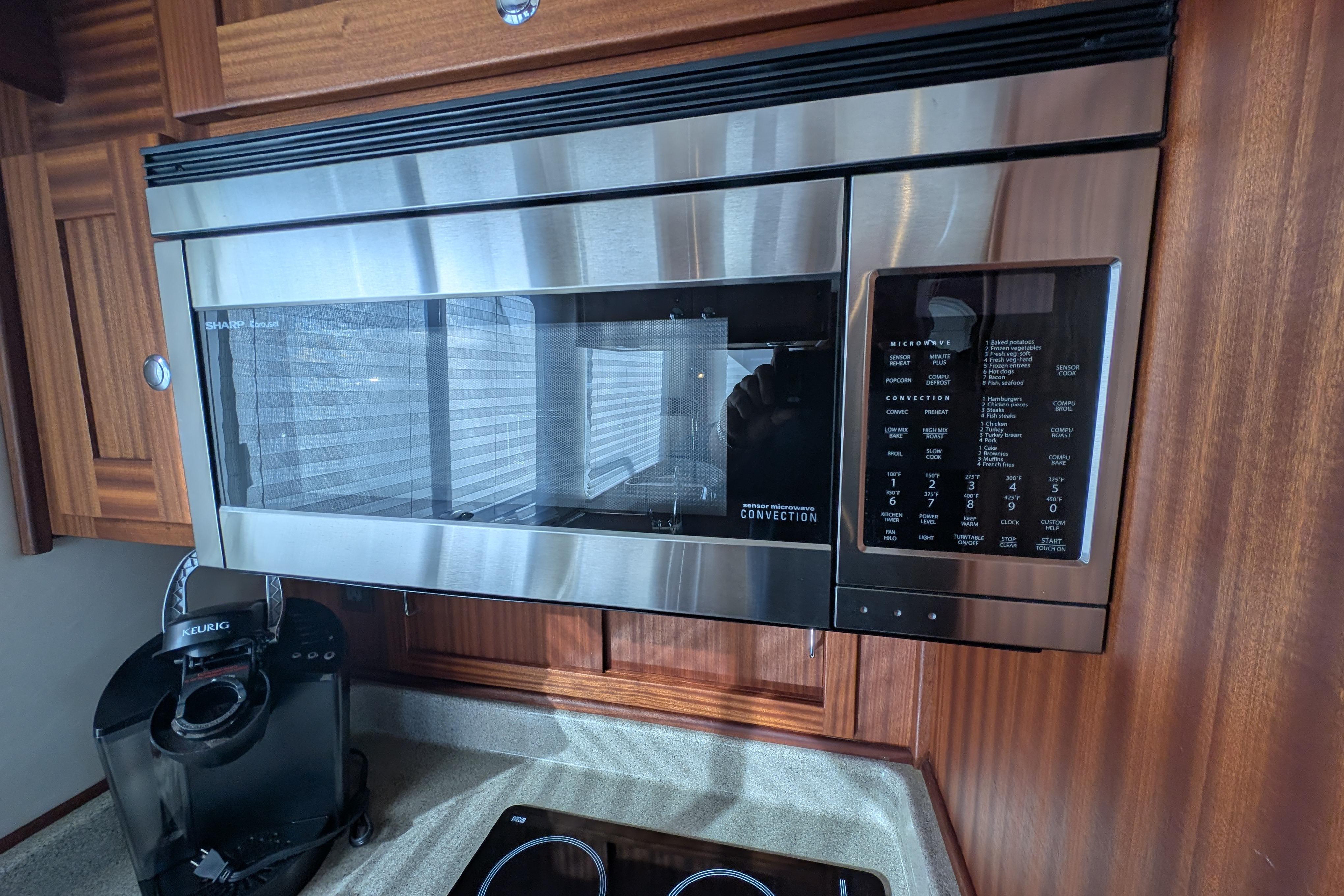Stainless steel microwave and Keurig in 2015 American Tug 435 kitchen.