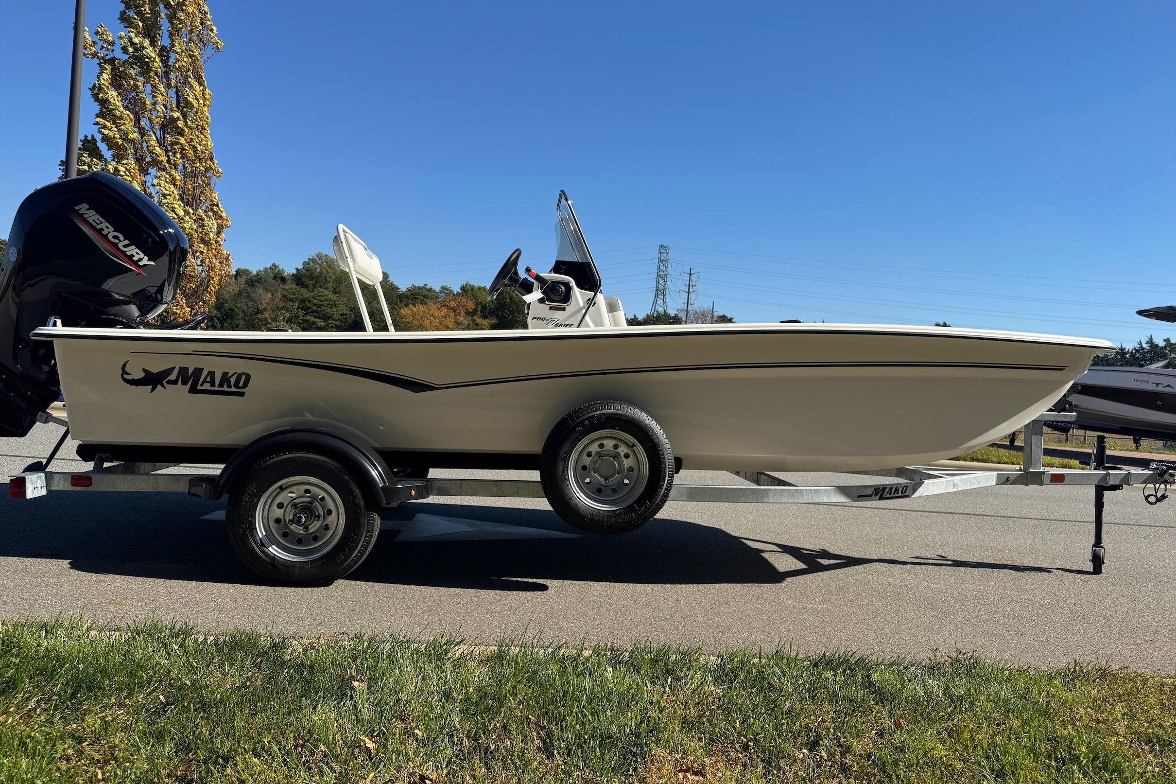 2026 Mako Pro Skiff 17 CC boat on trailer, sunny day, side view.