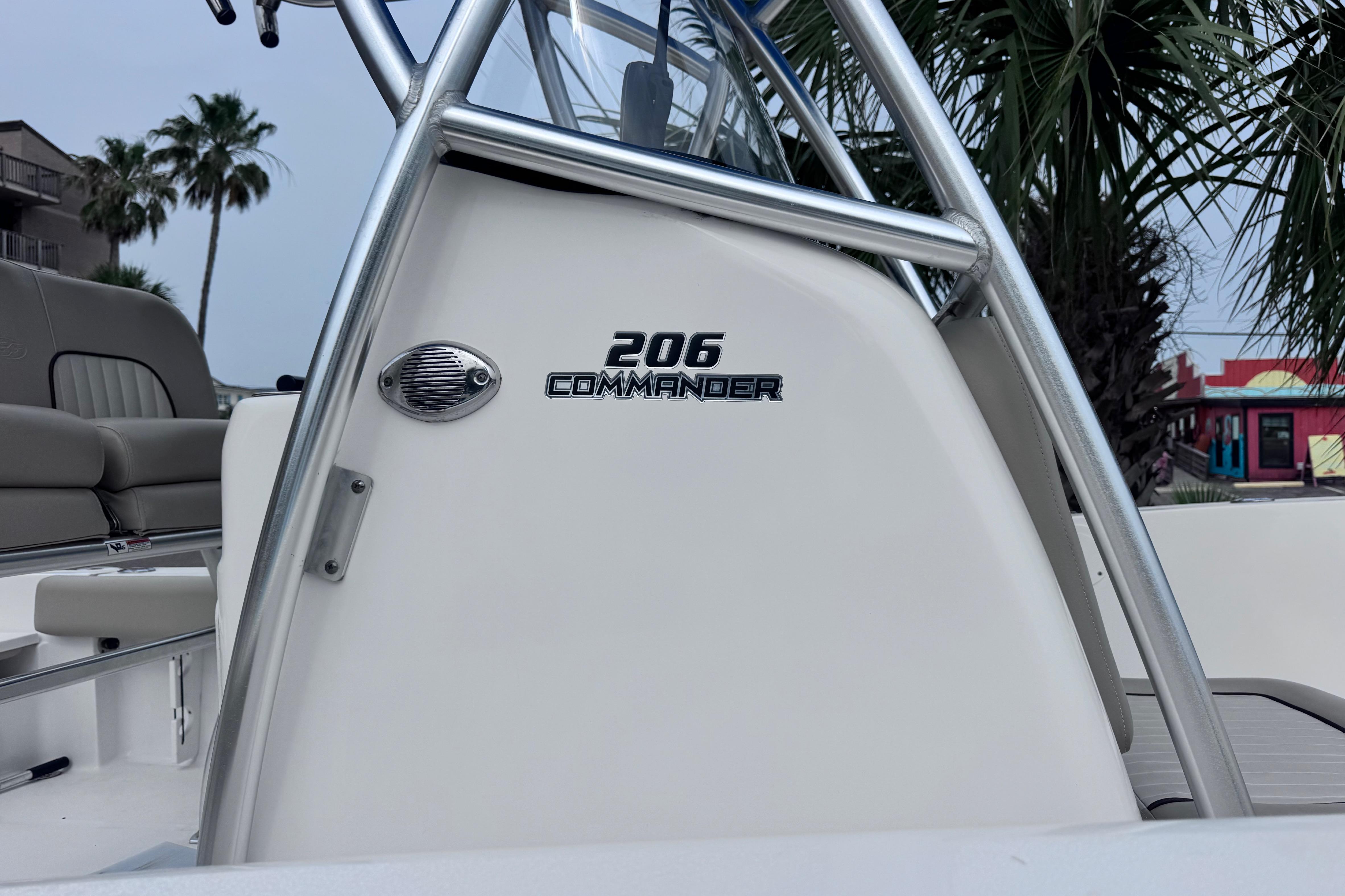 2018 Sea Fox 206 Commander boat console with palm trees in the background.