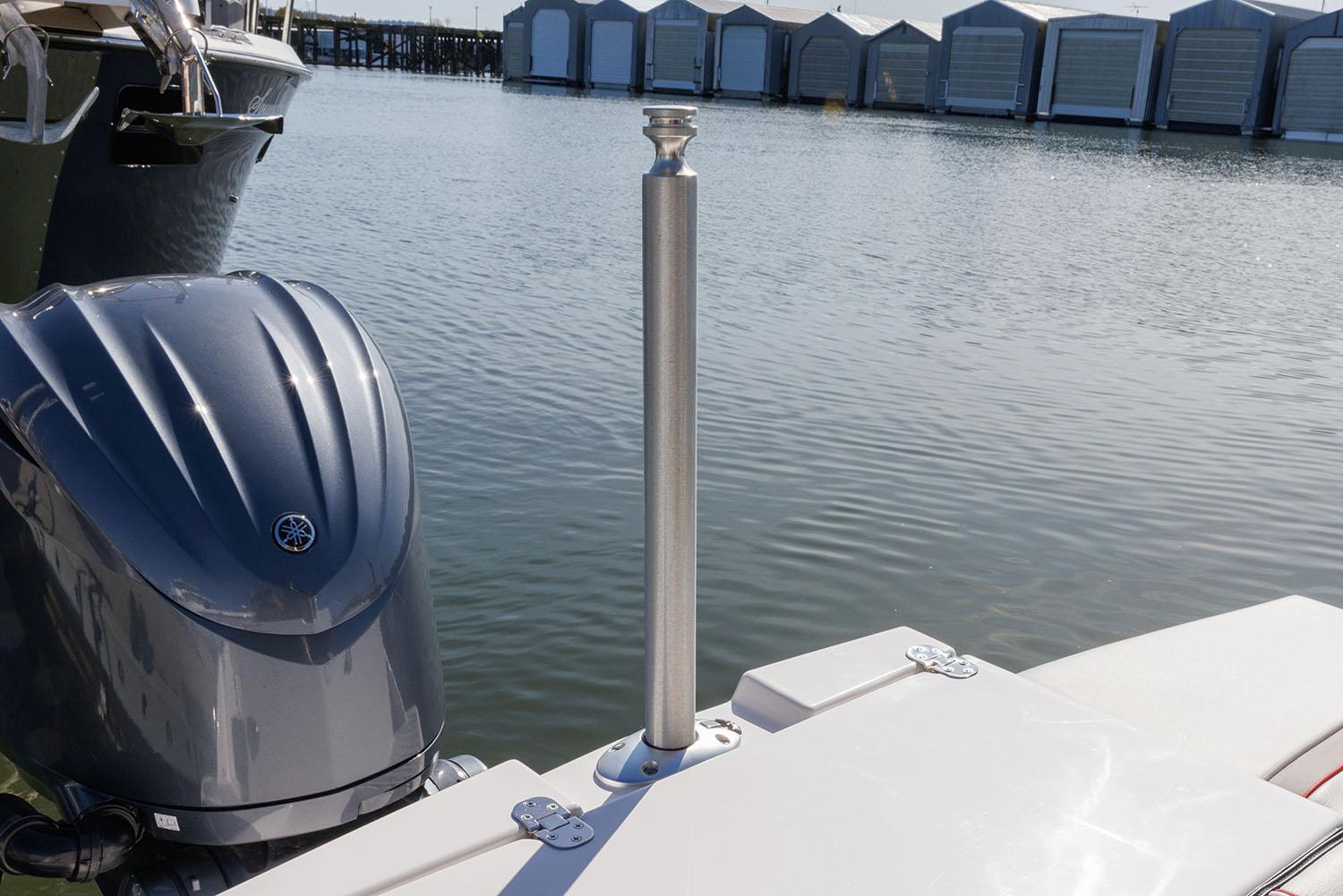 Manufacturer Provided Image: Boat docked by water with outboard motor, featuring Solara S-250 Coupe, 2025 model.