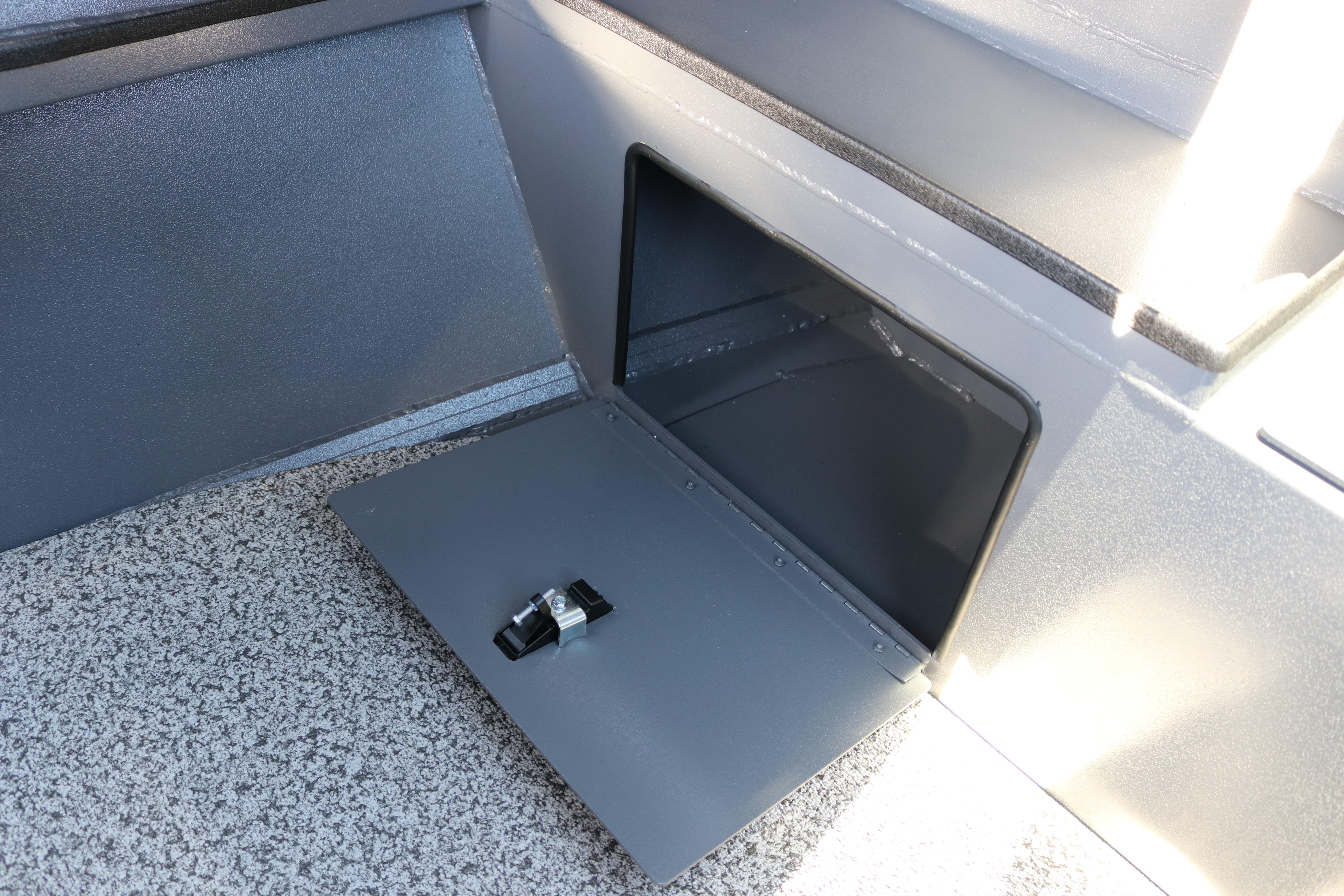 2026 Alumaweld Stryker X202 storage compartment with open hatch and secure latch.