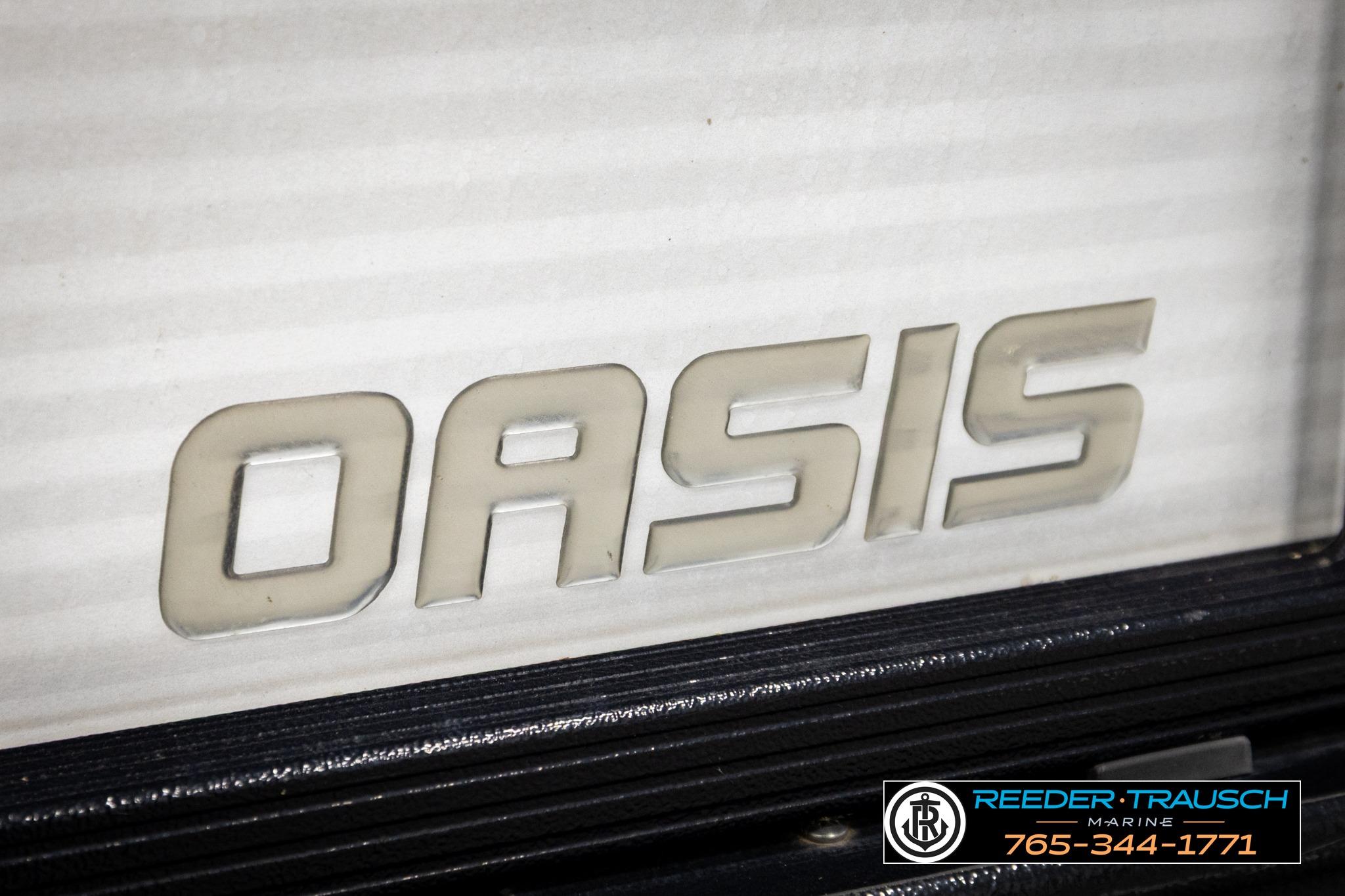 Close-up of 2019 Manitou Oasis SR VP logo on a boat, featuring dealership contact details.