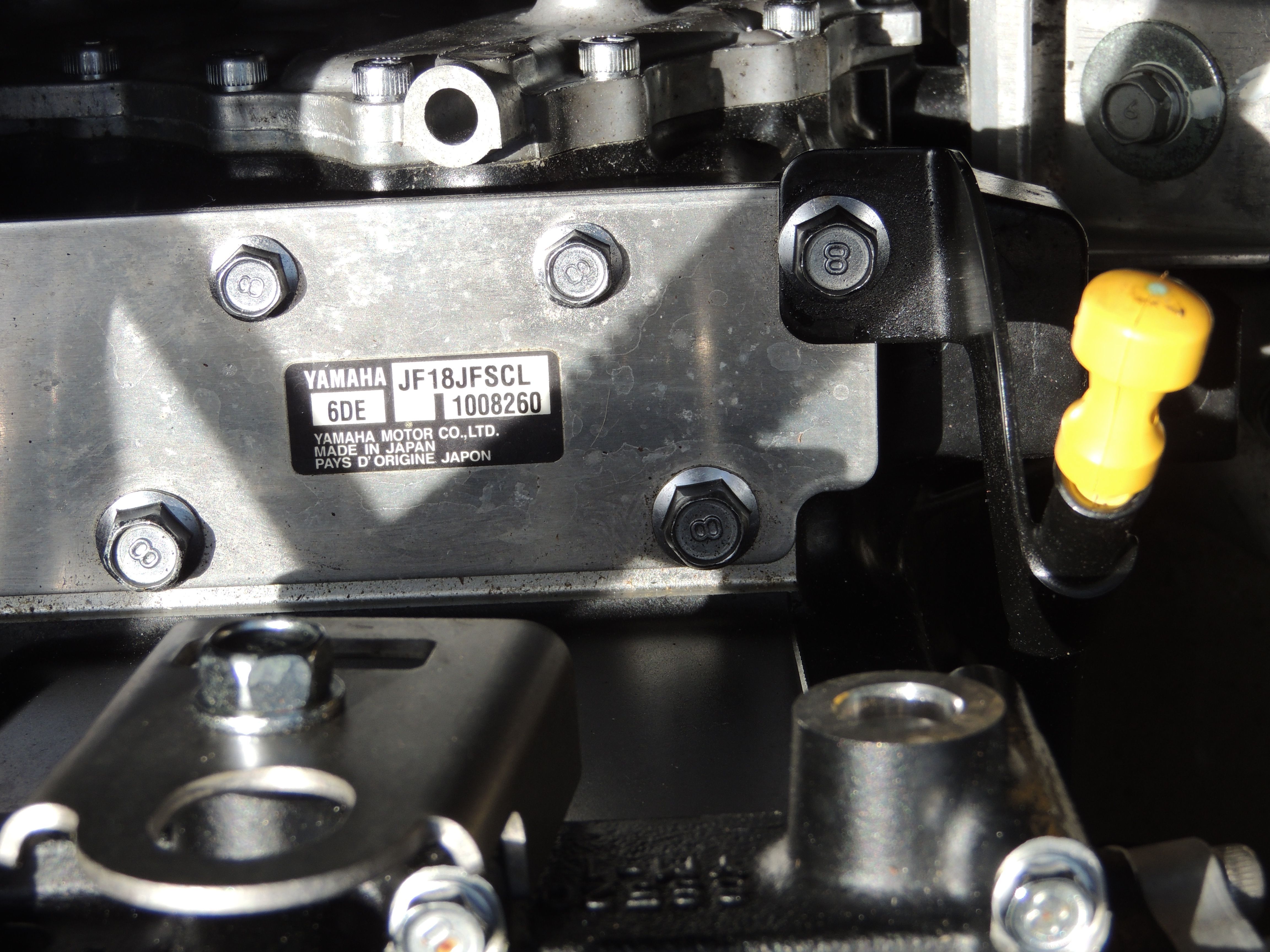 Close-up of a Yamaha SX190 2023 engine part with serial number.