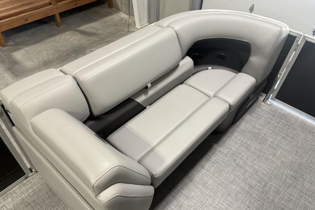 2026 Sun Tracker PARTY BARGE® 20 DLX interior seating with plush gray upholstery.