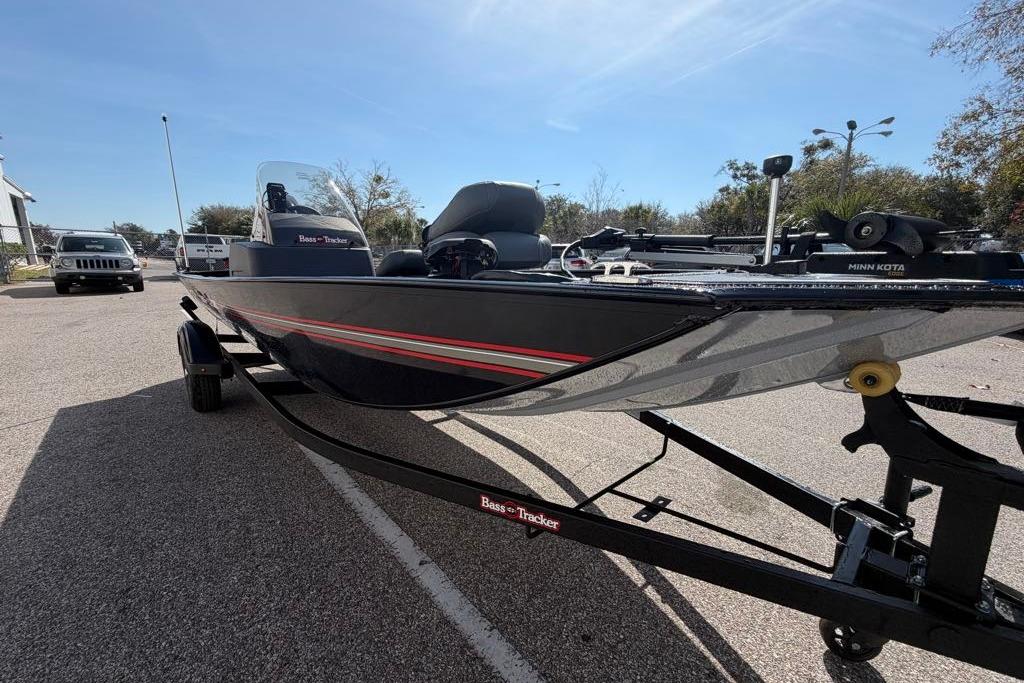 2026 Tracker Bass Tracker Classic XL boat on trailer in parking lot.