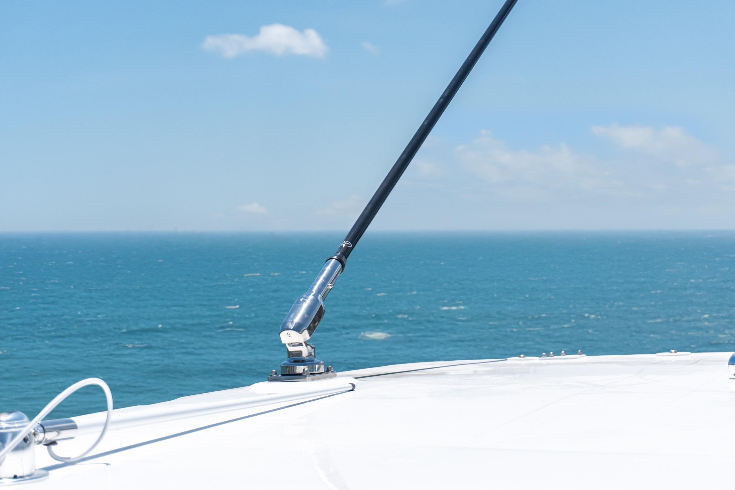 Bow of 2026 Twin Vee 400 GFX2 CC boat with ocean view and clear sky.