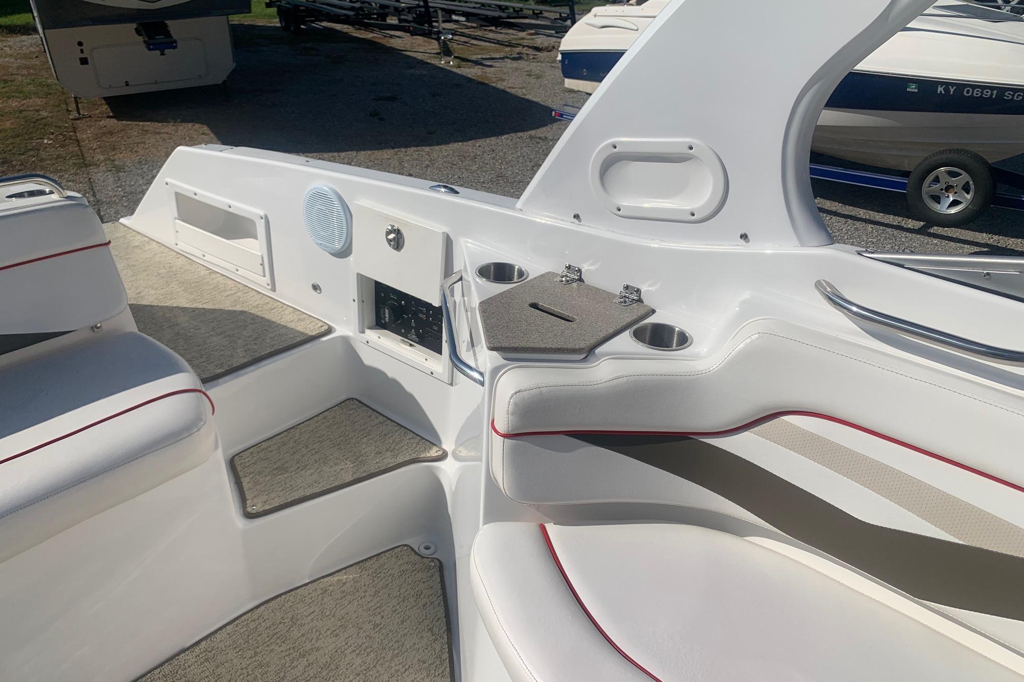 2006 Rinker 282 Captiva Cuddy interior with seating, speaker, and cup holders.