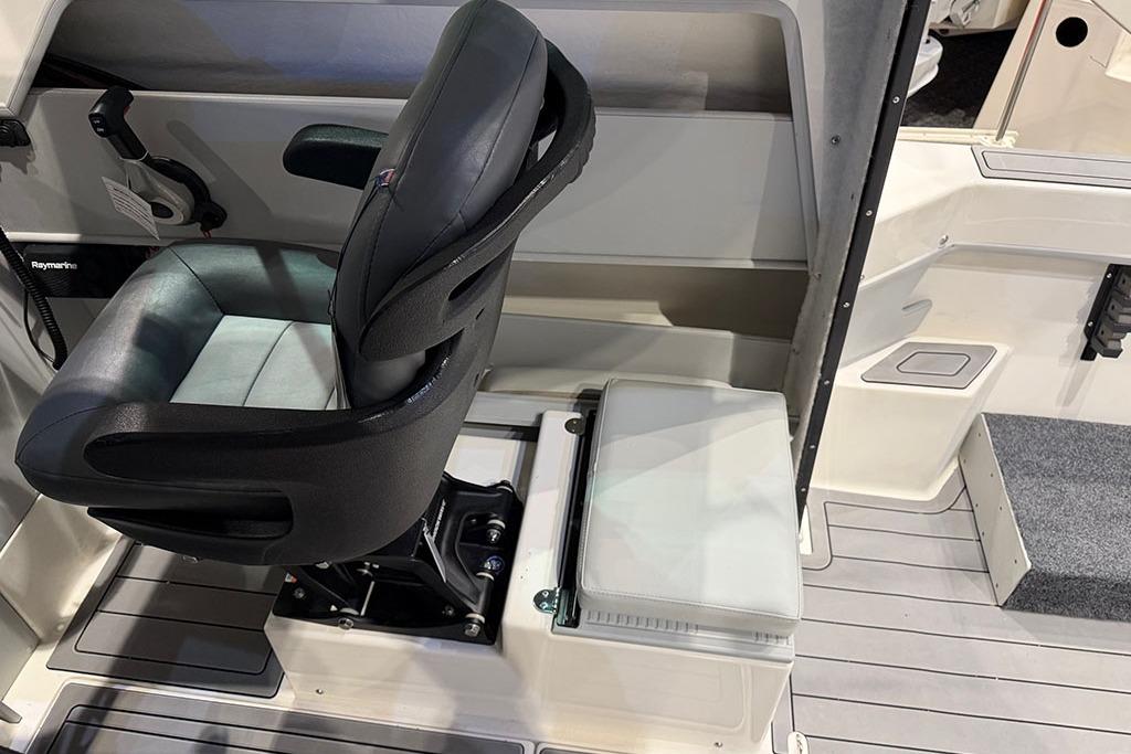 Interior of 2027 Arima Sea Ranger 21 Hardtop, featuring a comfortable captain's chair and sleek design.