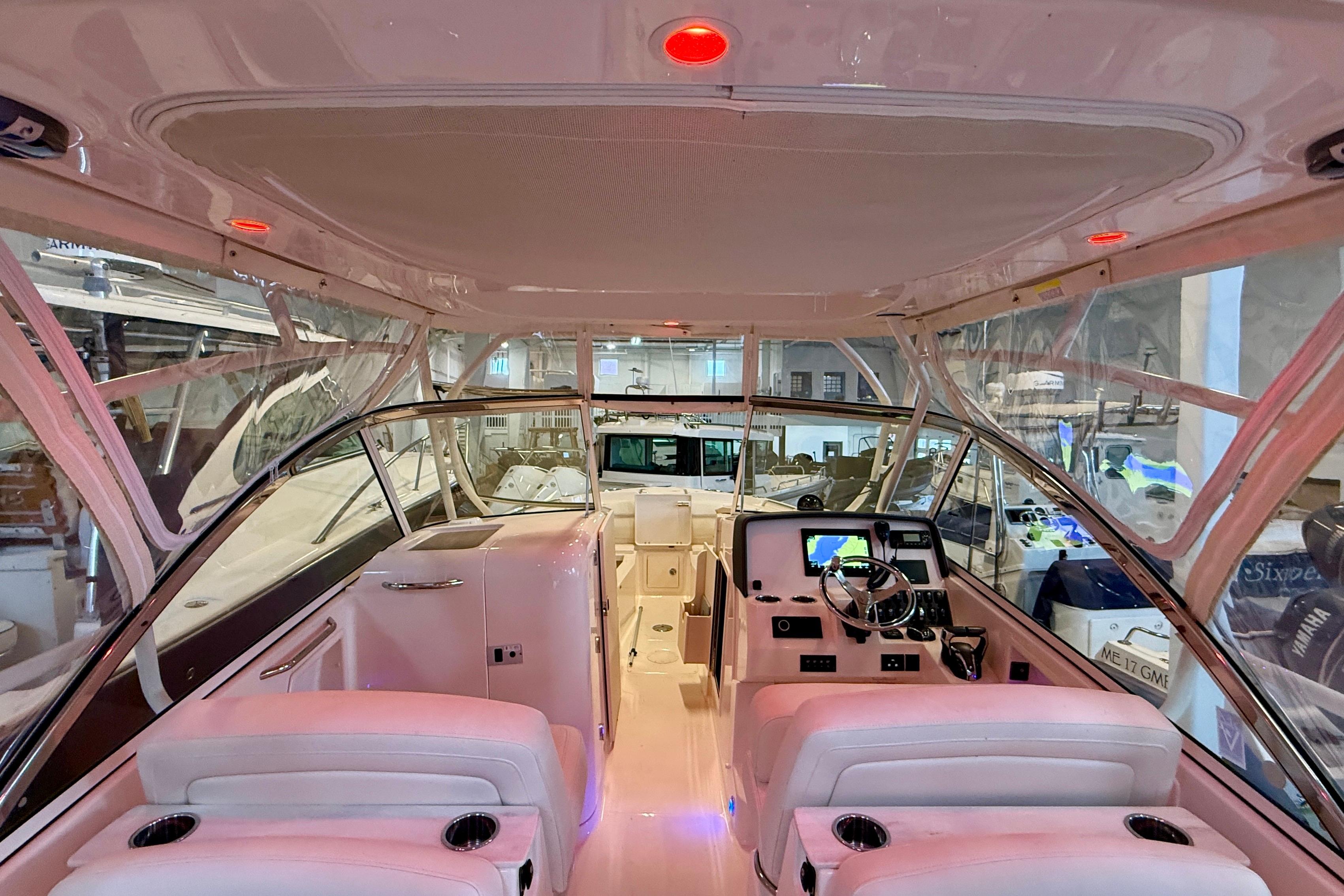 Interior view of 2023 Grady-White Freedom 285 boat, featuring modern helm and seating.