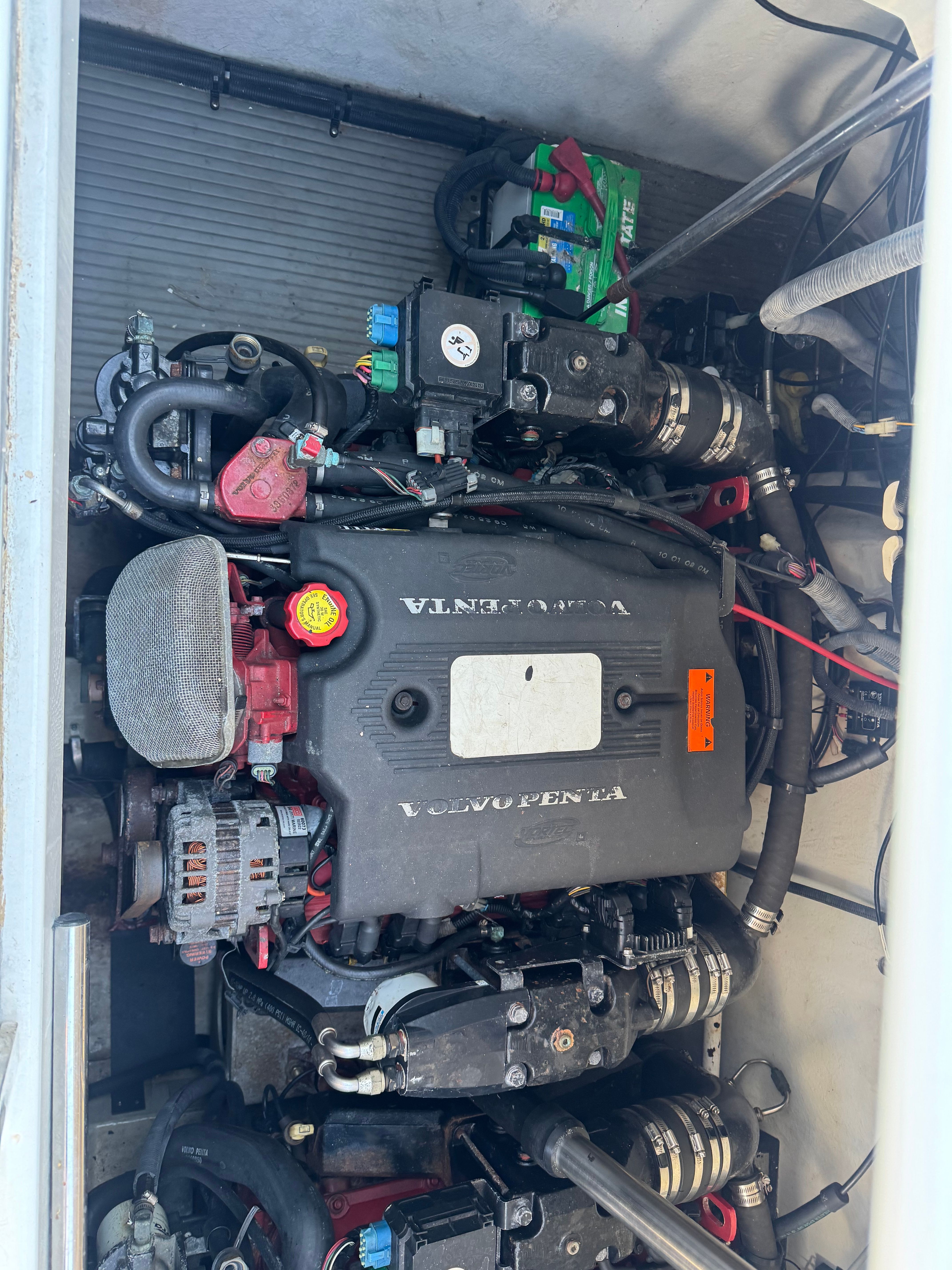 Engine compartment of a 2003 Cobalt 360 boat with a Volvo Penta engine.