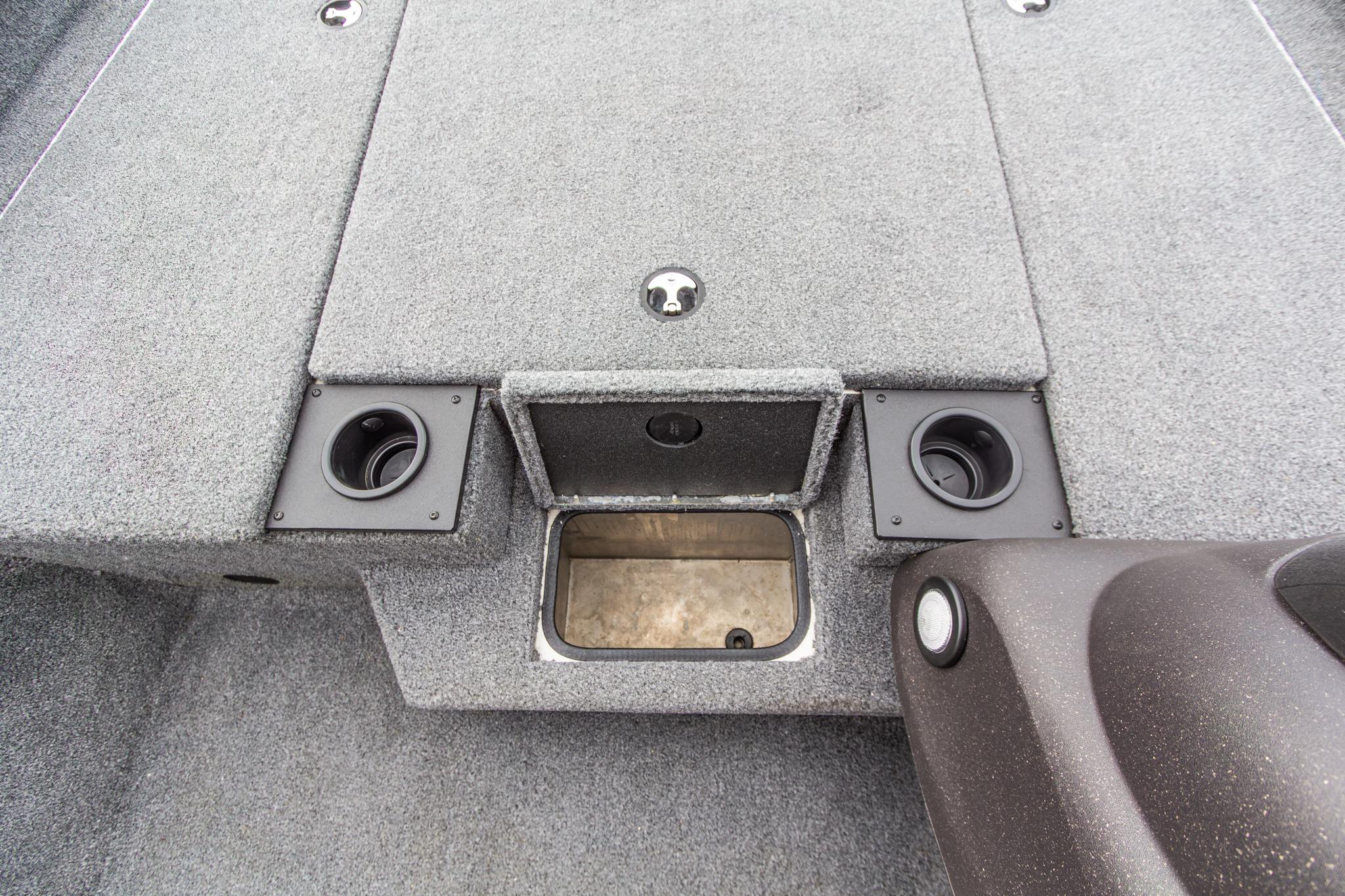 2023 Tracker Pro Team 190 TX boat interior with storage compartment and cup holders.