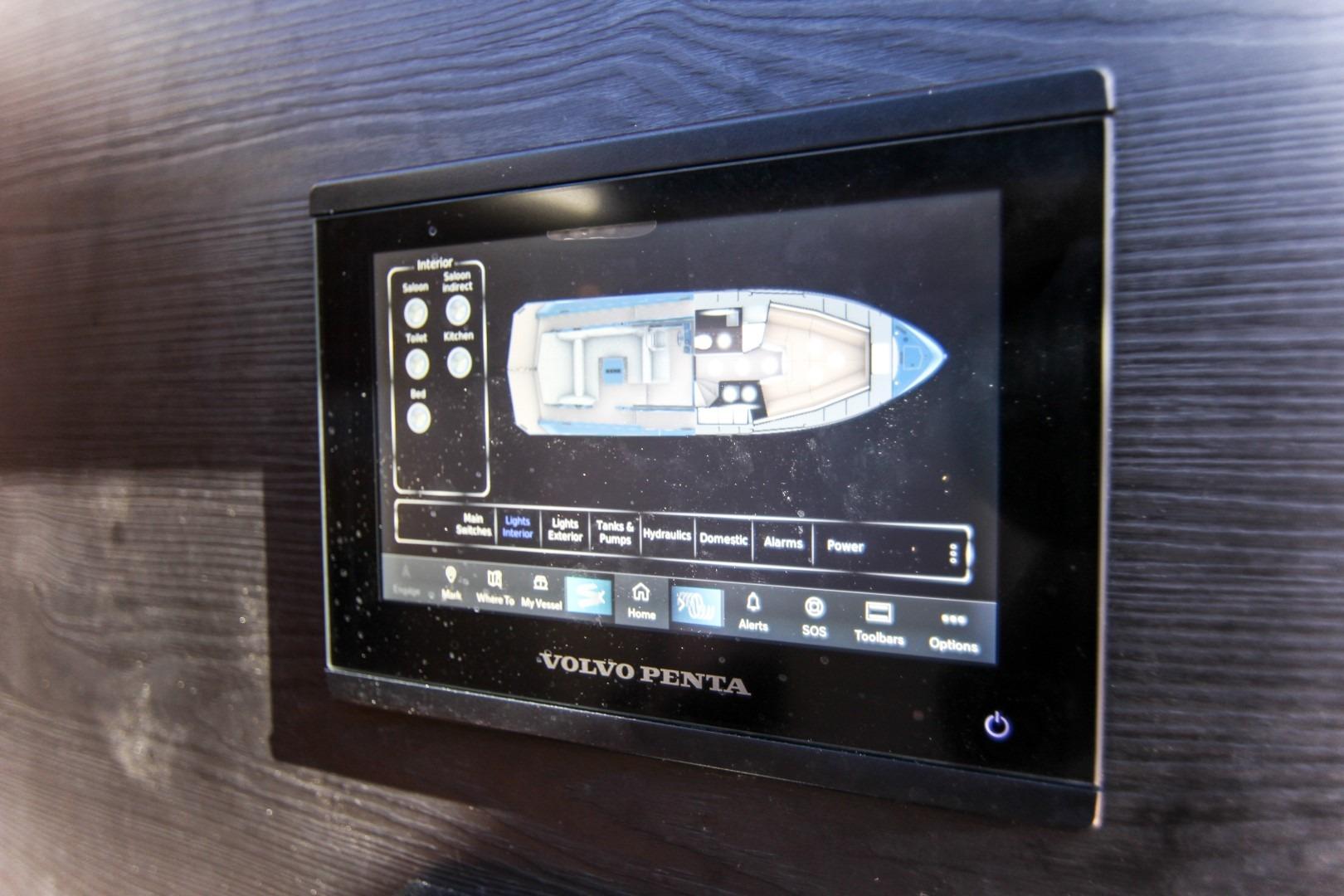 Touchscreen control panel on 2022 Vanquish Yachts VQ45, displaying interior layout and settings.