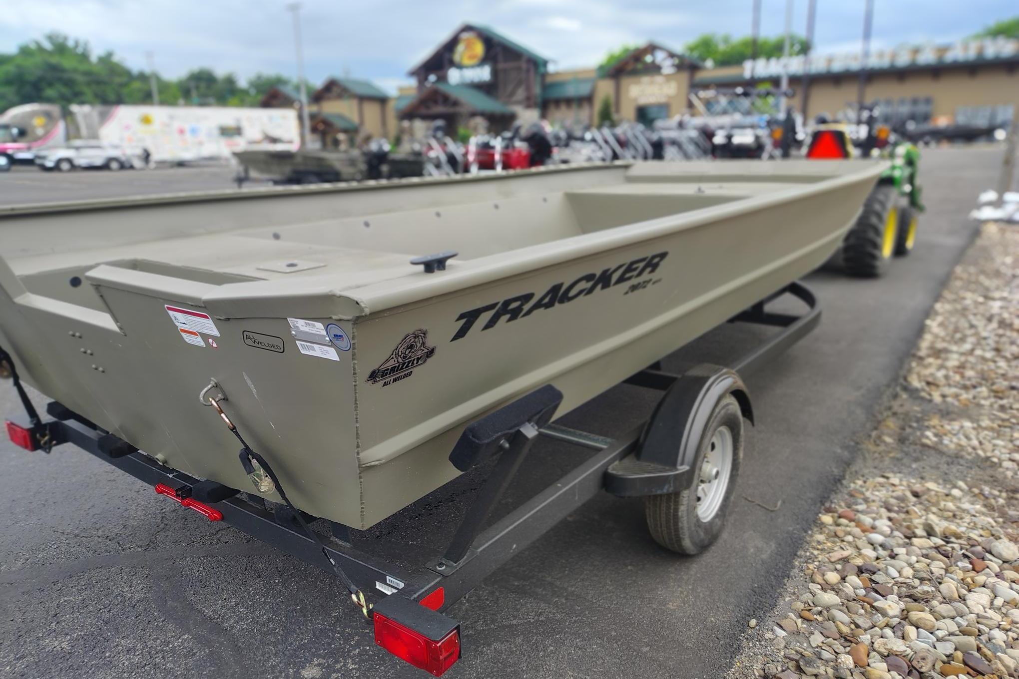 2026 Tracker Grizzly 2072 Utility boat on trailer in outdoor setting.