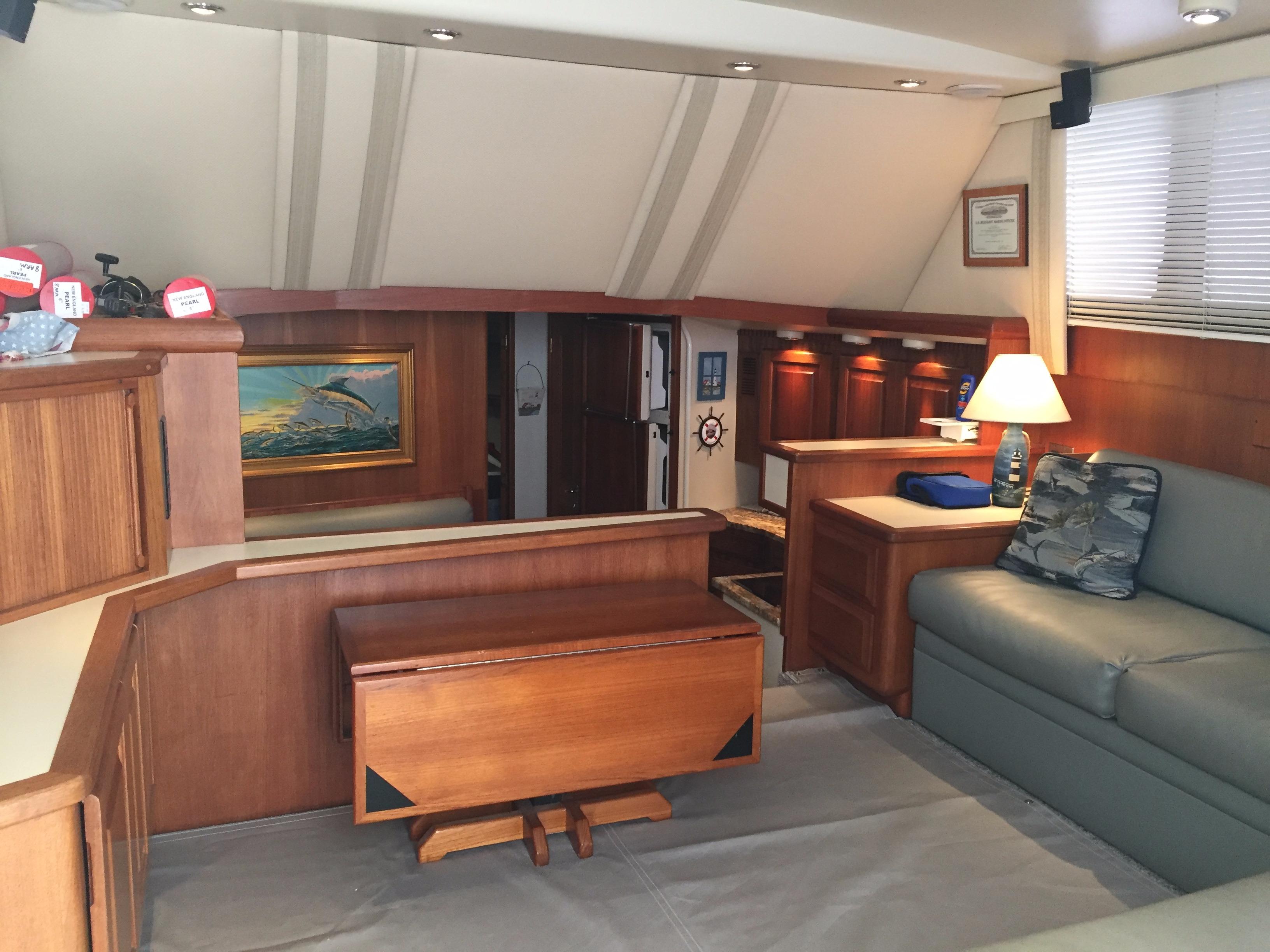 Interior of 1989 Viking 41 Sportfish Convertible with wooden furniture and cozy lighting.