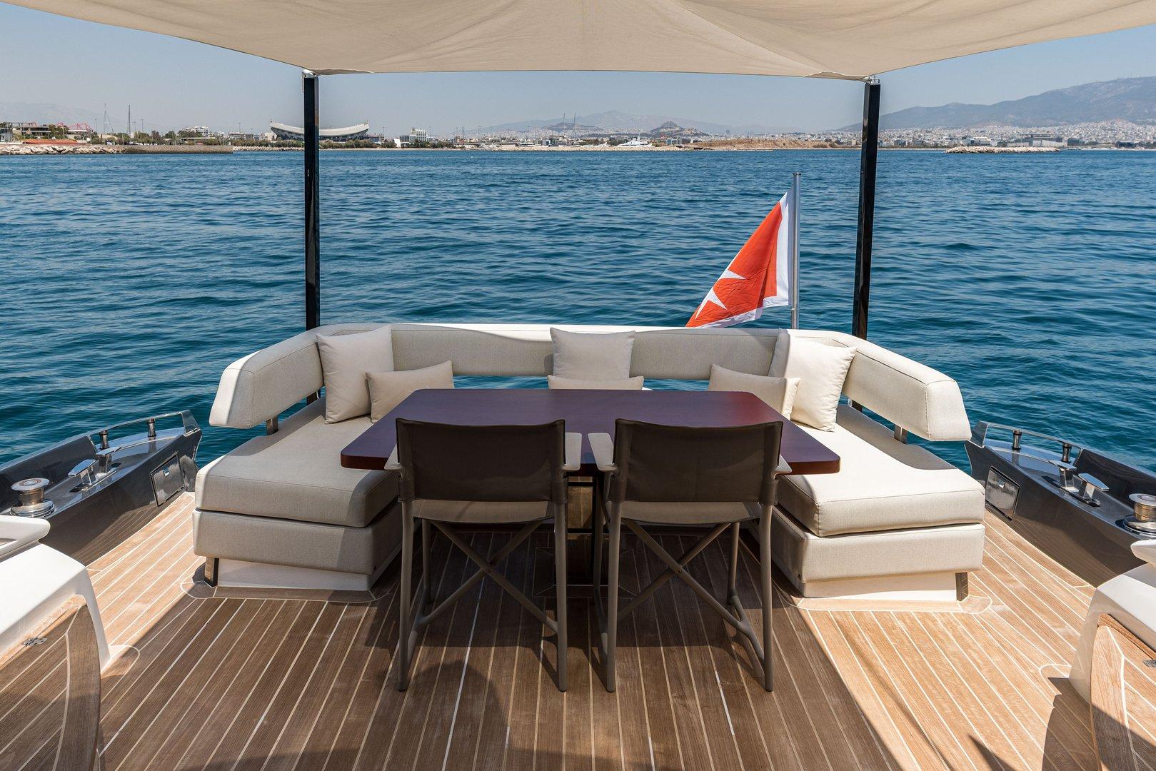 Luxurious deck of 2008 Baia Italia 70 yacht with seating and sea view.