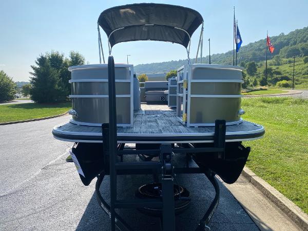 2024 Ranger Reata 223C pontoon boat on trailer, parked outdoors.