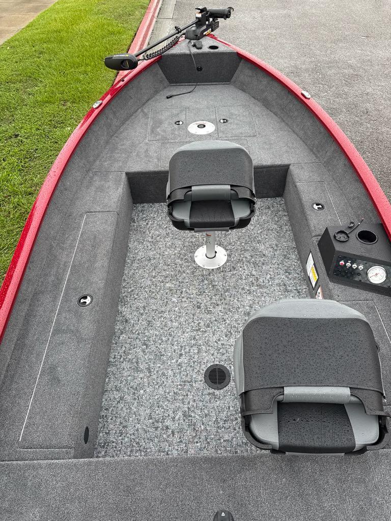 2025 Tracker Super Guide V-16 T boat interior with seating and controls.
