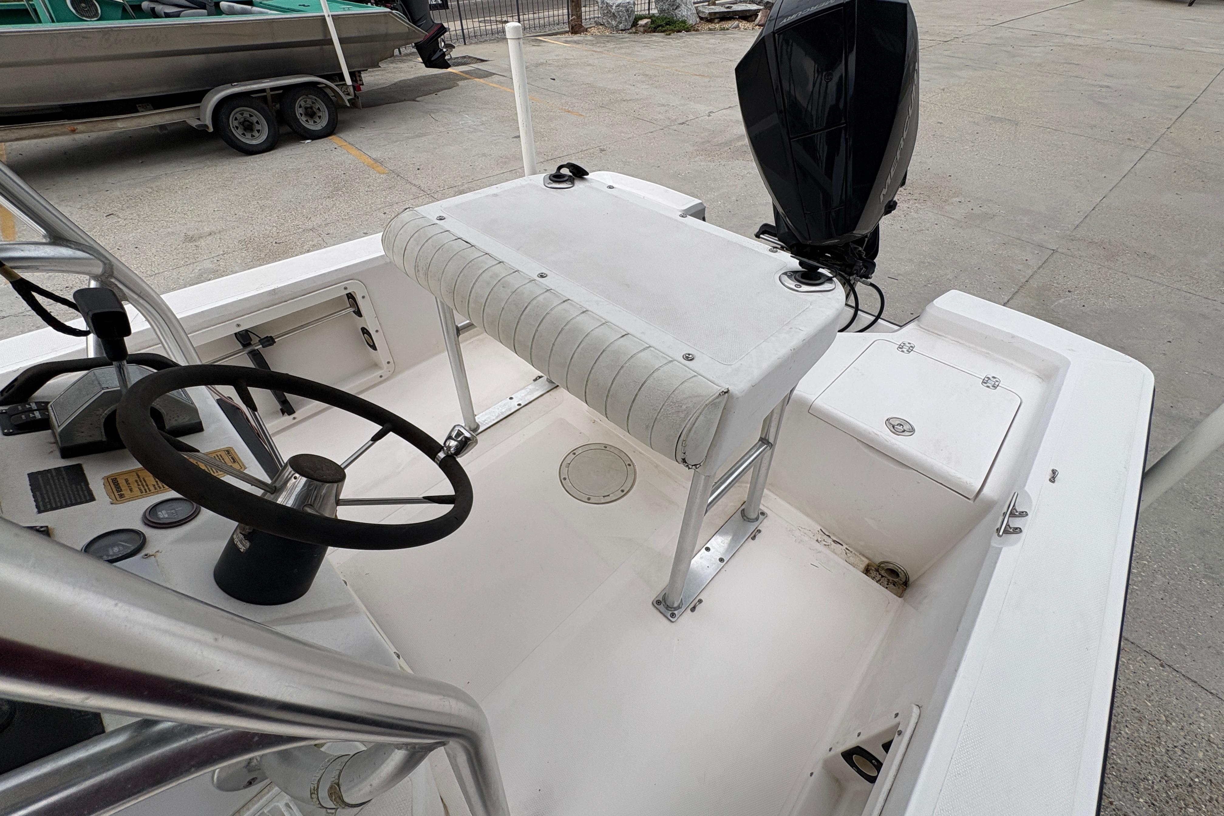 Interior of a 2000 Kenner 21 VISION boat with steering wheel and seating.