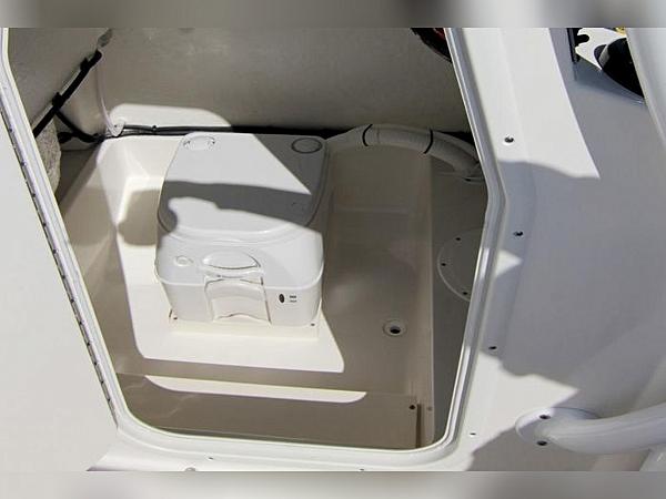 2023 Sea Born LX22 Center Console boat interior with compact toilet.