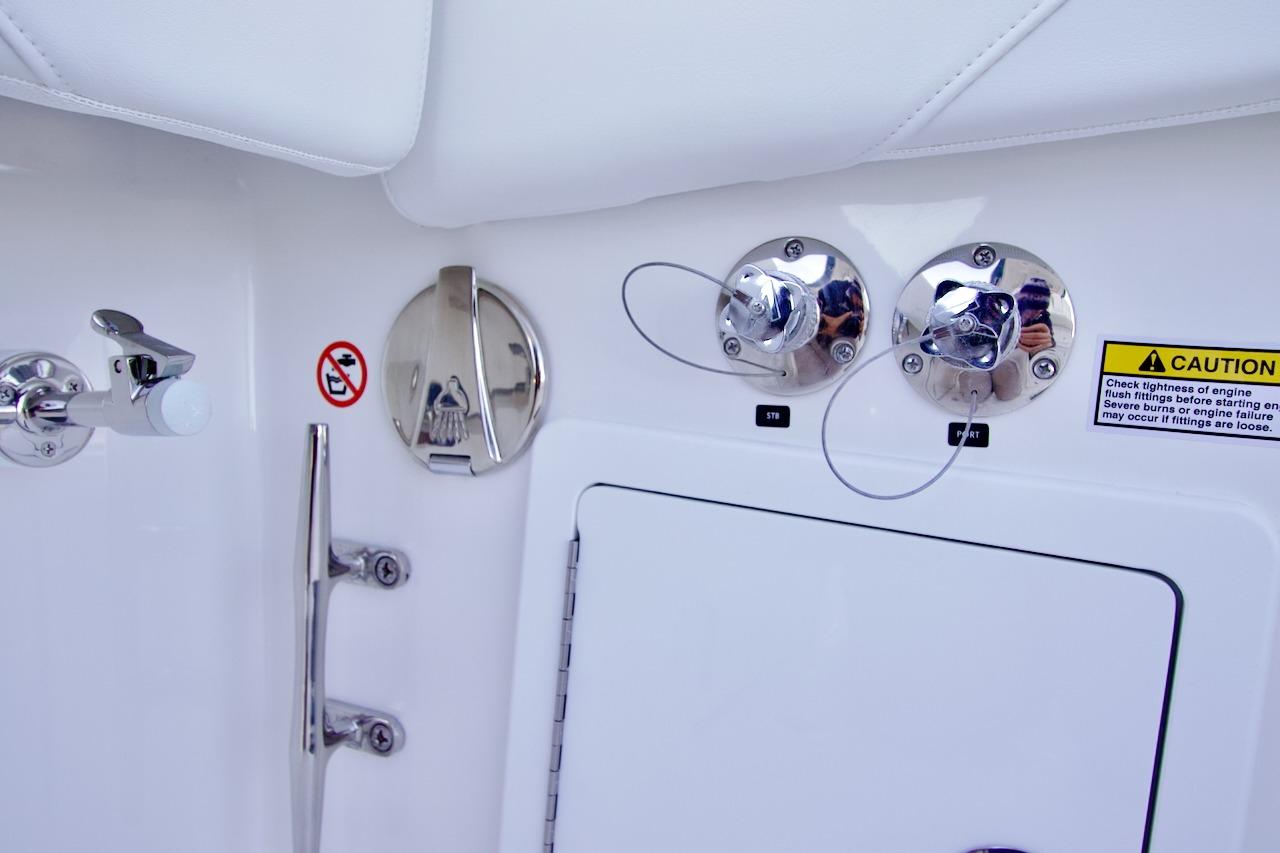 2026 Regulator 31 boat fittings and caution label on white surface.