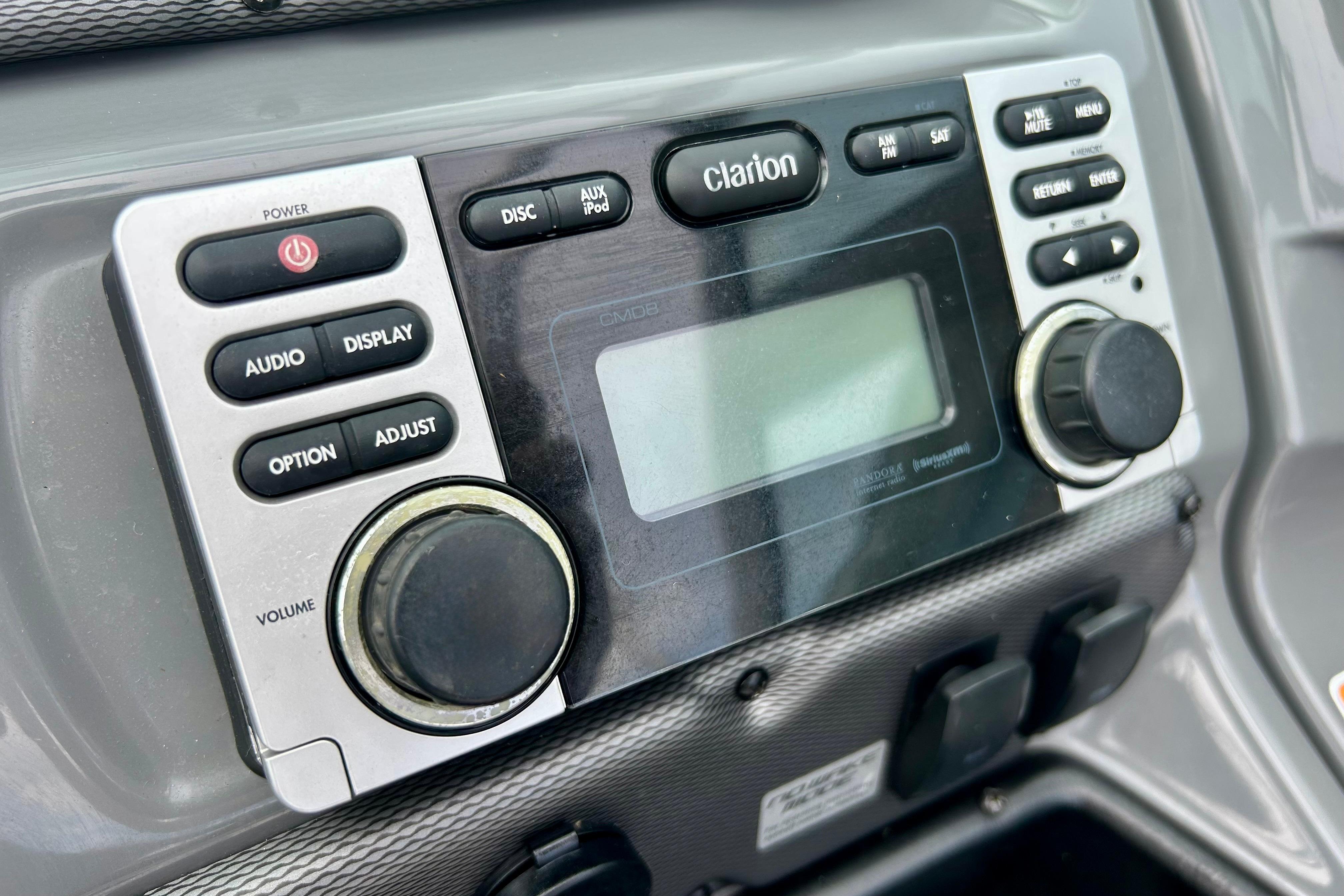 Close-up of Clarion audio system in 2015 Yamaha AR210 boat dashboard.