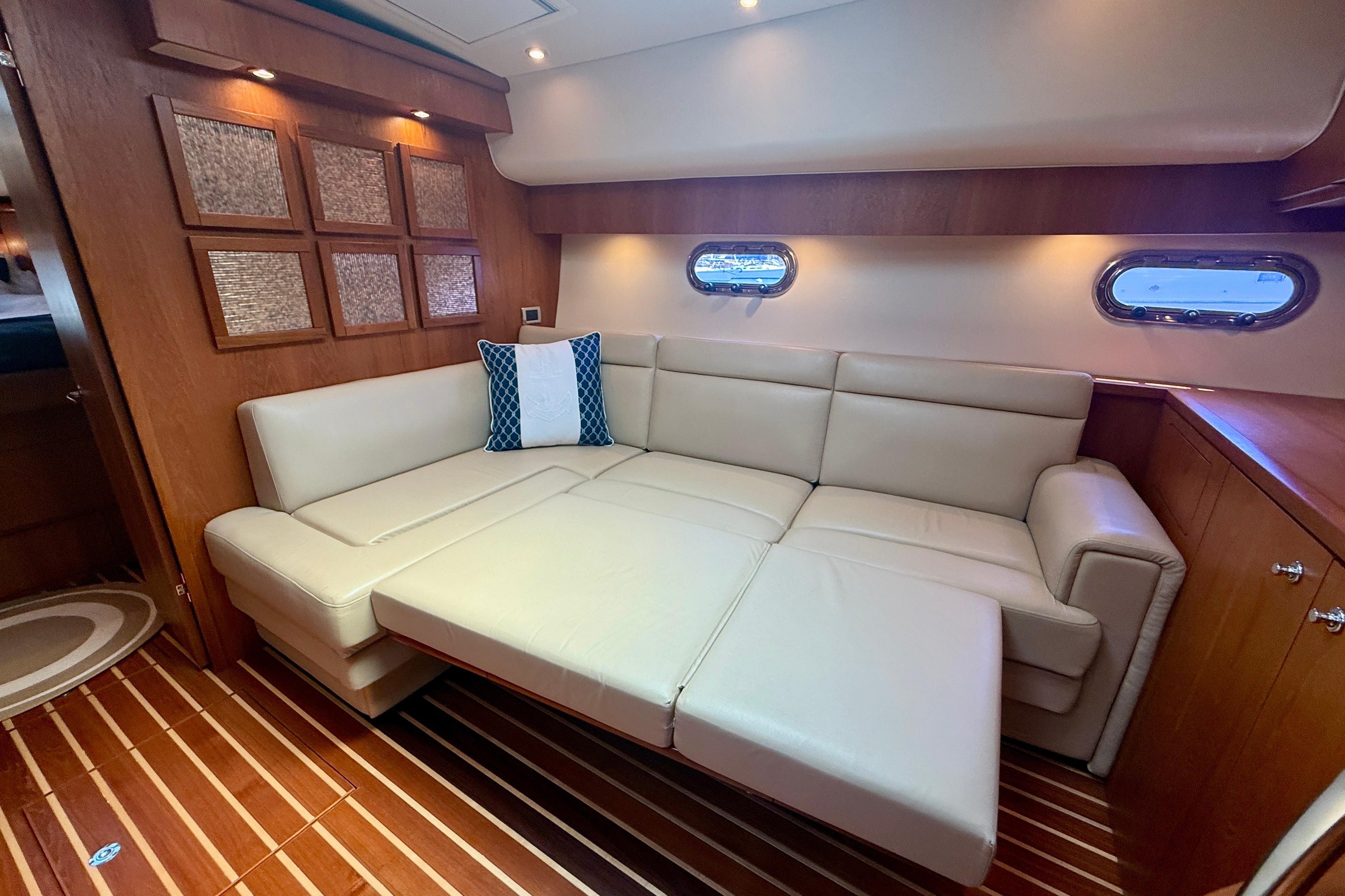 Luxurious interior of 2012 Tiara Yachts 4500 Sovran with beige leather seating.