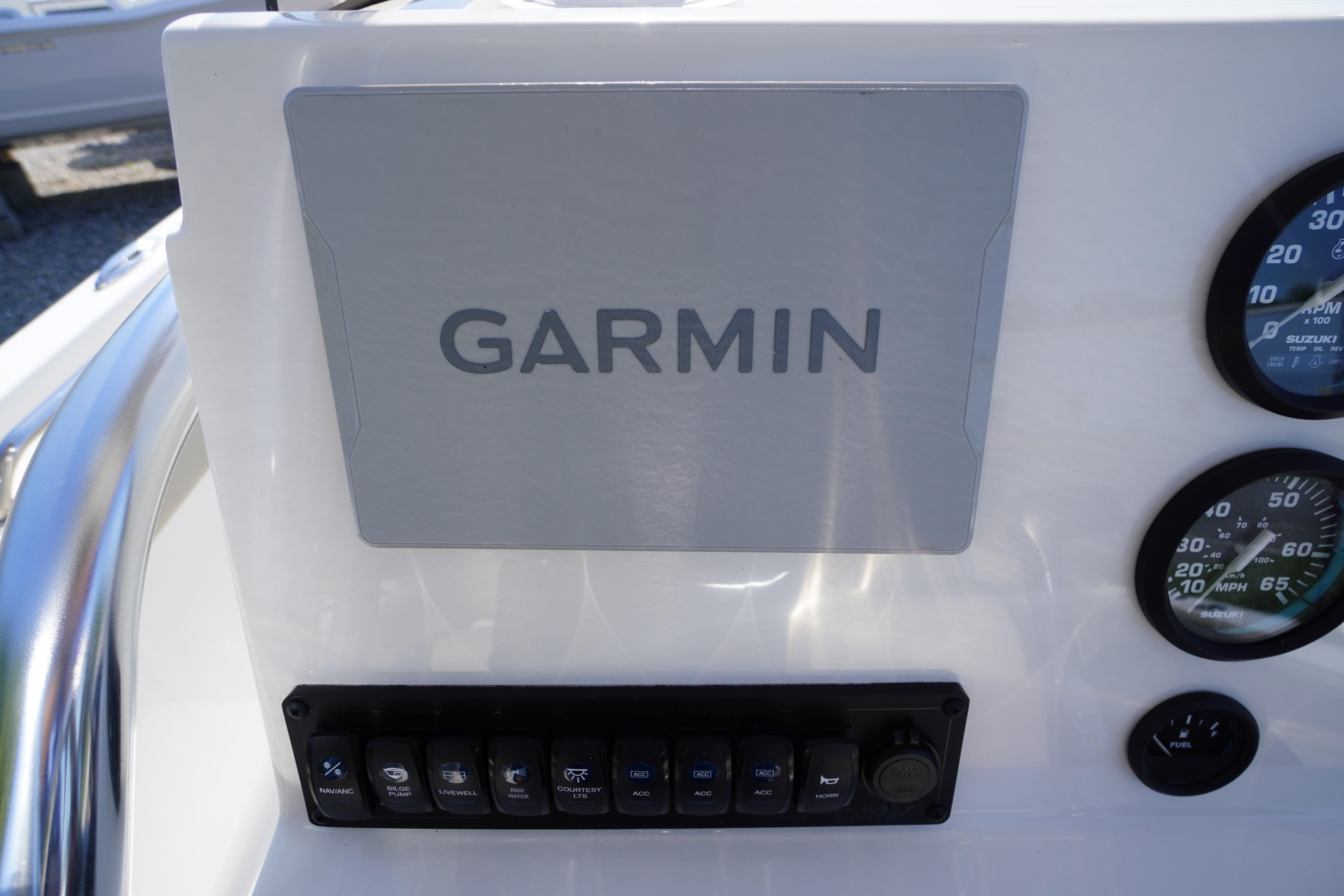 Garmin navigation system on 2025 Key West 203 FS boat dashboard with gauges.