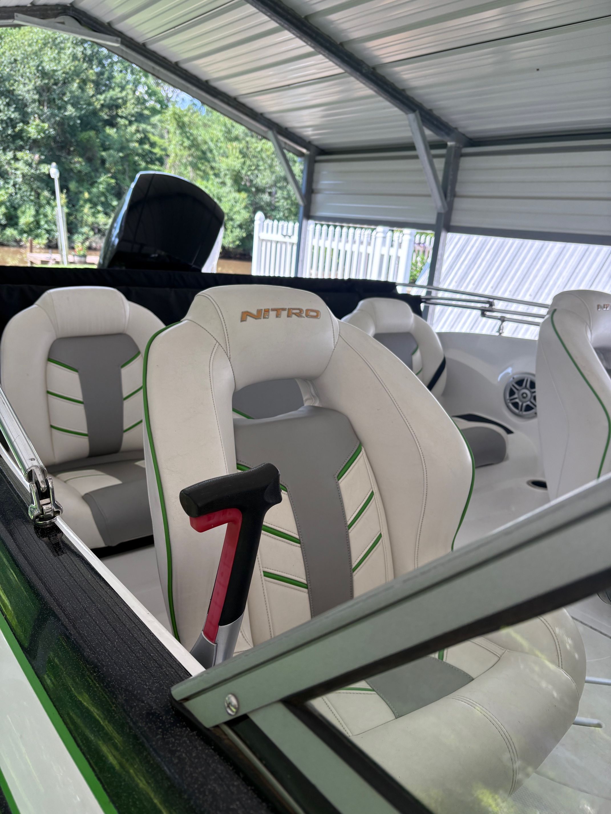 Interior view of a 2021 Nitro Z19 Sport boat with white and gray seats.